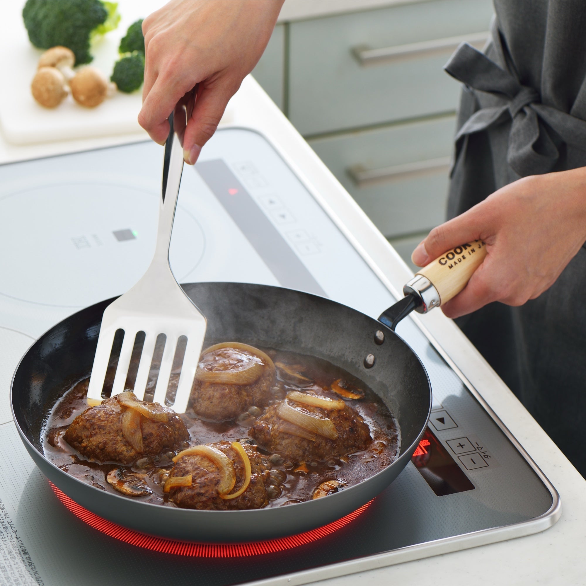 How to Use and Care for Your Carbon Steel Wok, Fry Pan, and Cookware for cooking meat and vegetables in a frying pan.