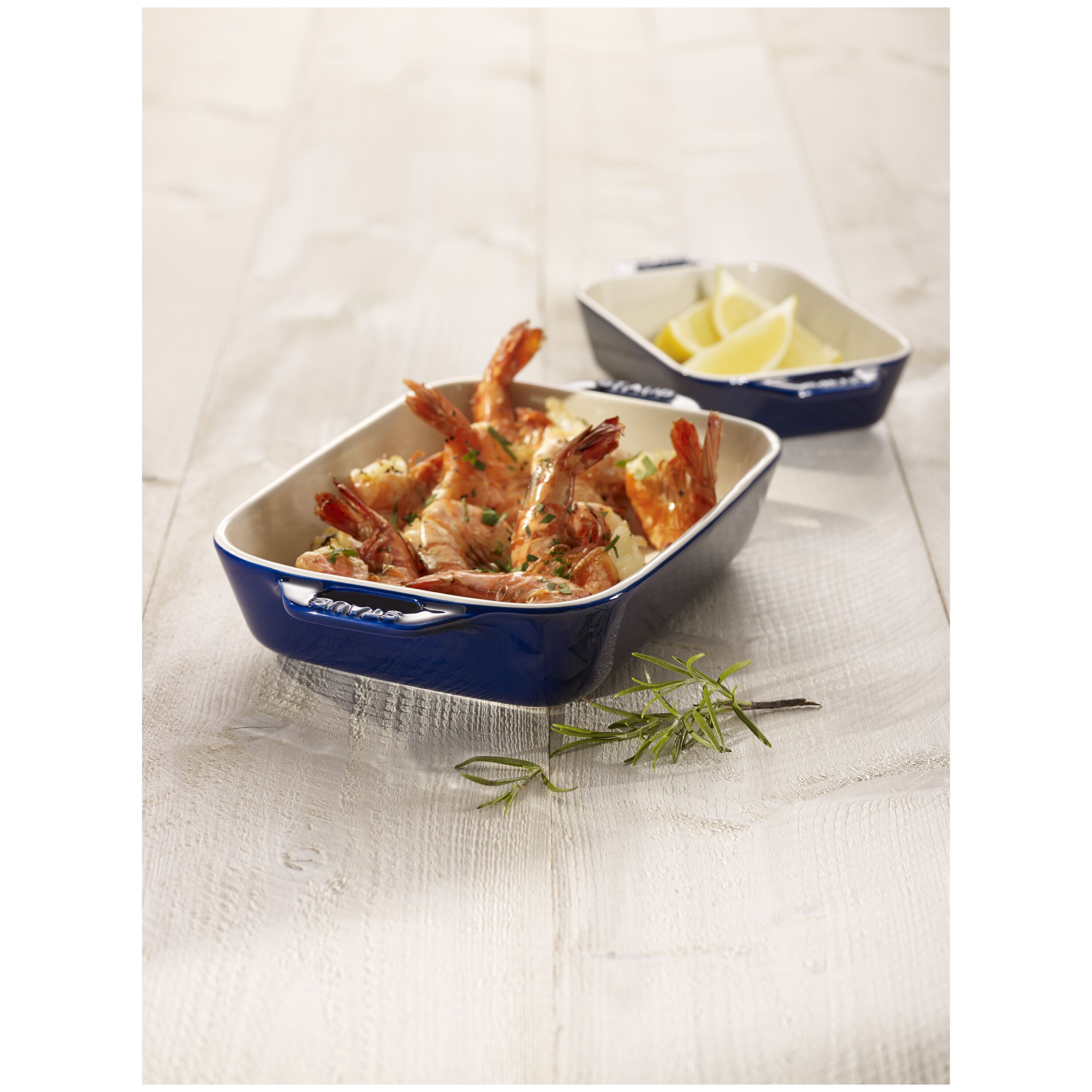STAUB Ceramique Ceramic Rectangular Oven Dish with cooked shrimp on a white tablecloth