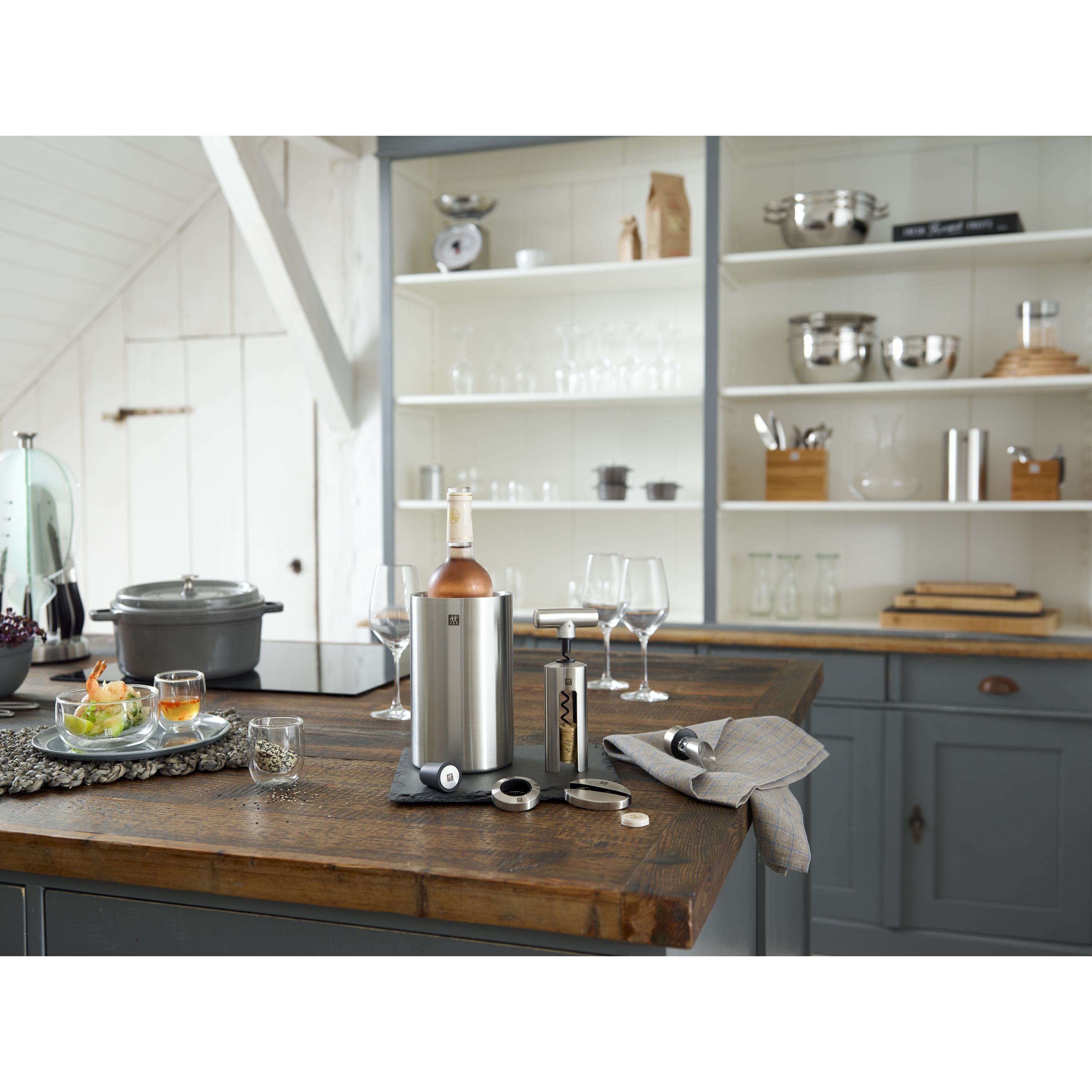 Kitchen counter with wine accessories and shelves in the background