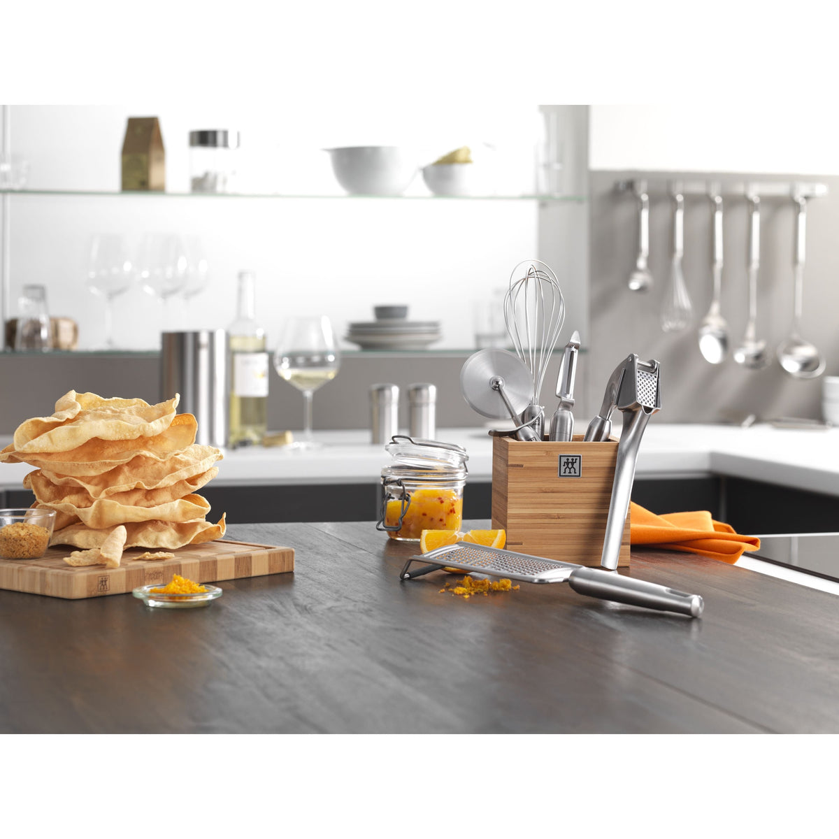 Kitchen counter with utensils, food, and a blurred background
