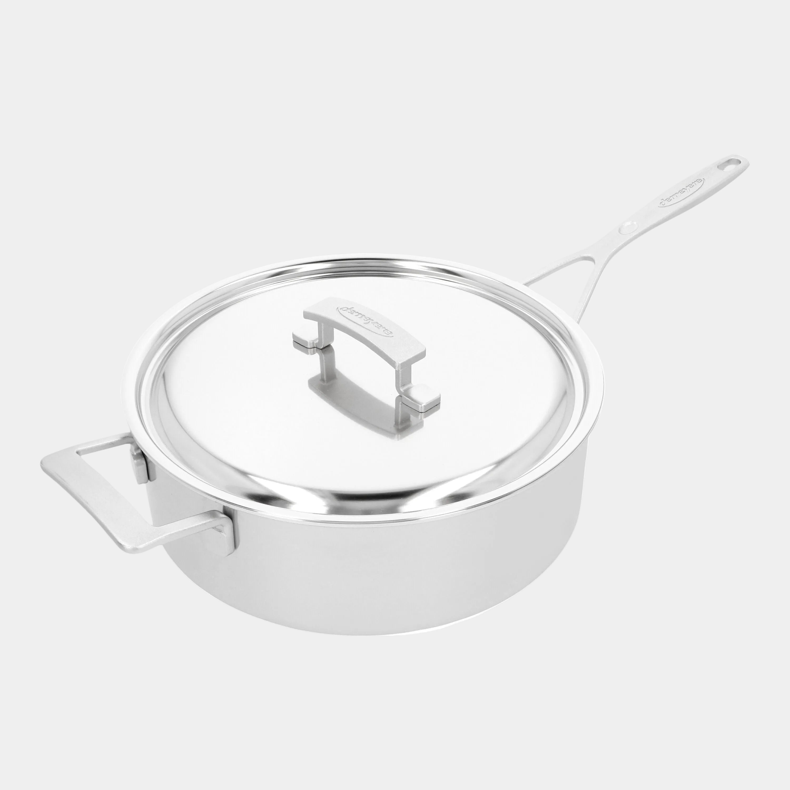 Stainless steel pot with lid on a white background