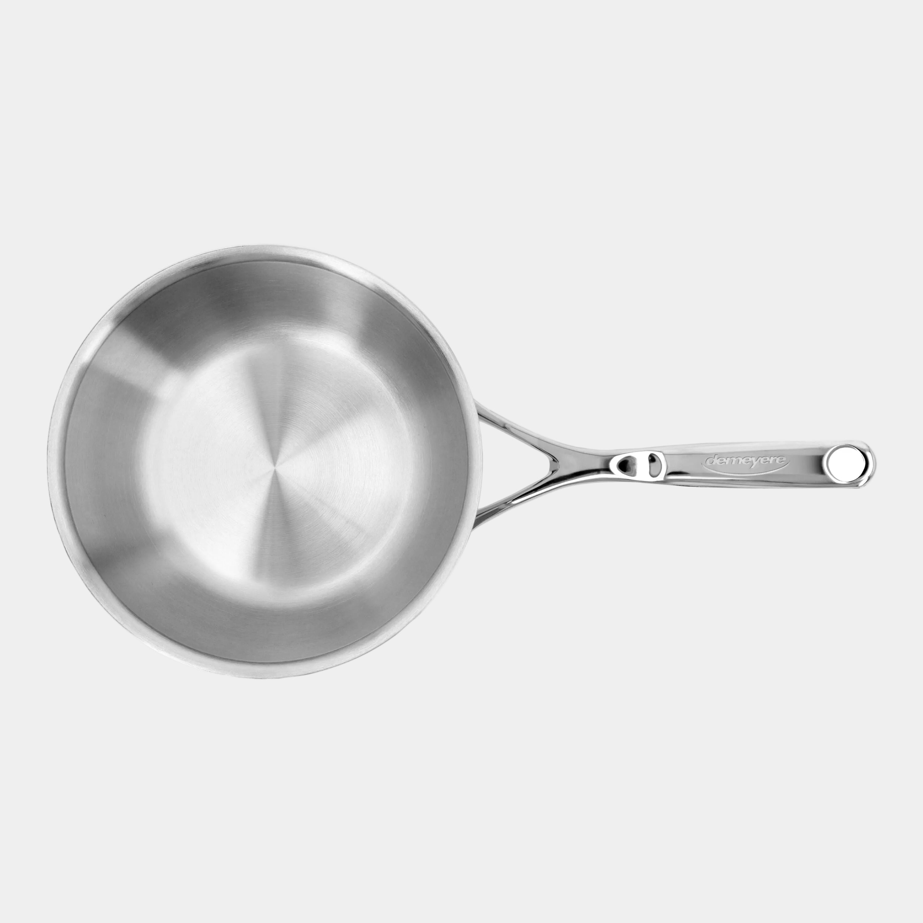 Stainless steel frying pan on a white background