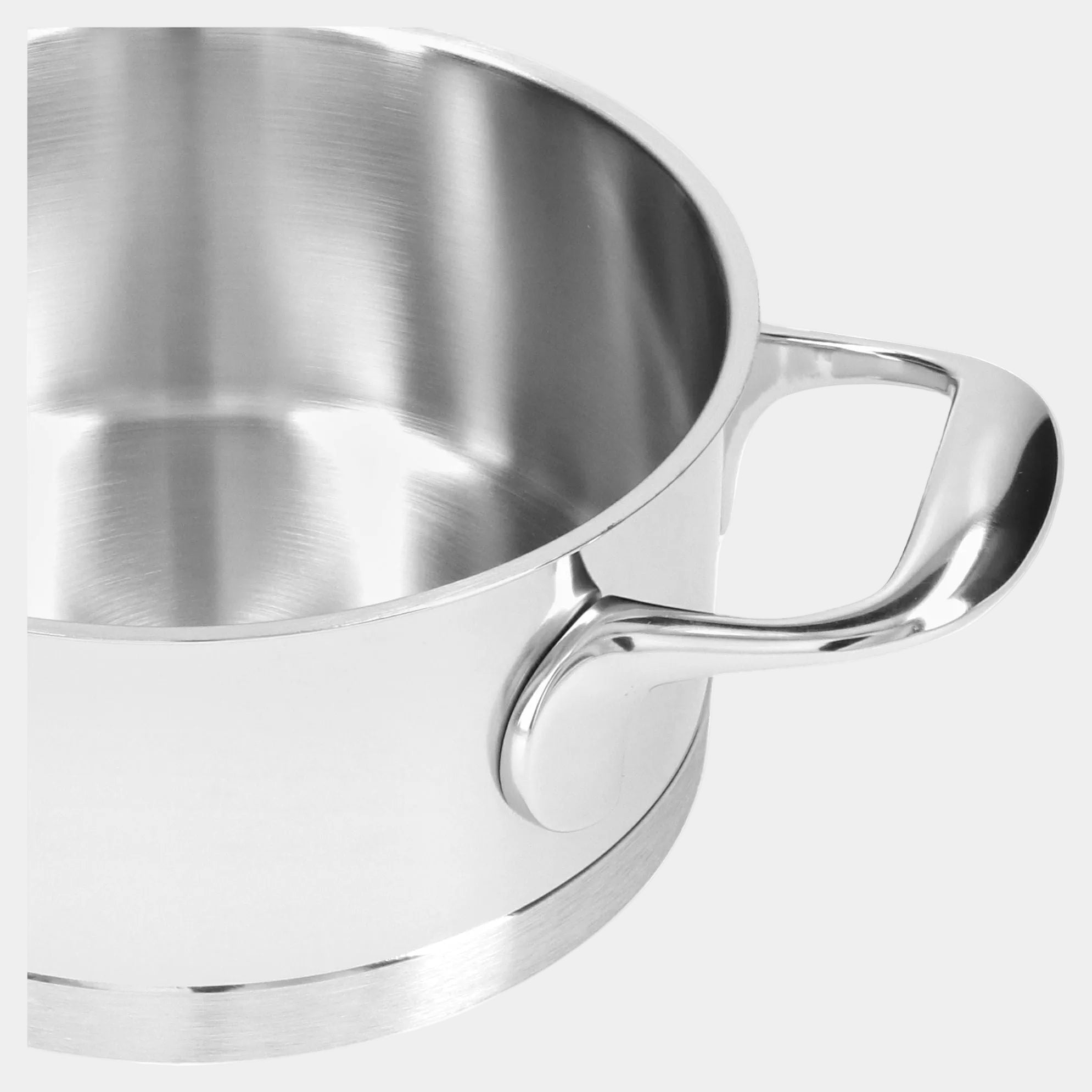 Stainless steel cup with handle on a white background