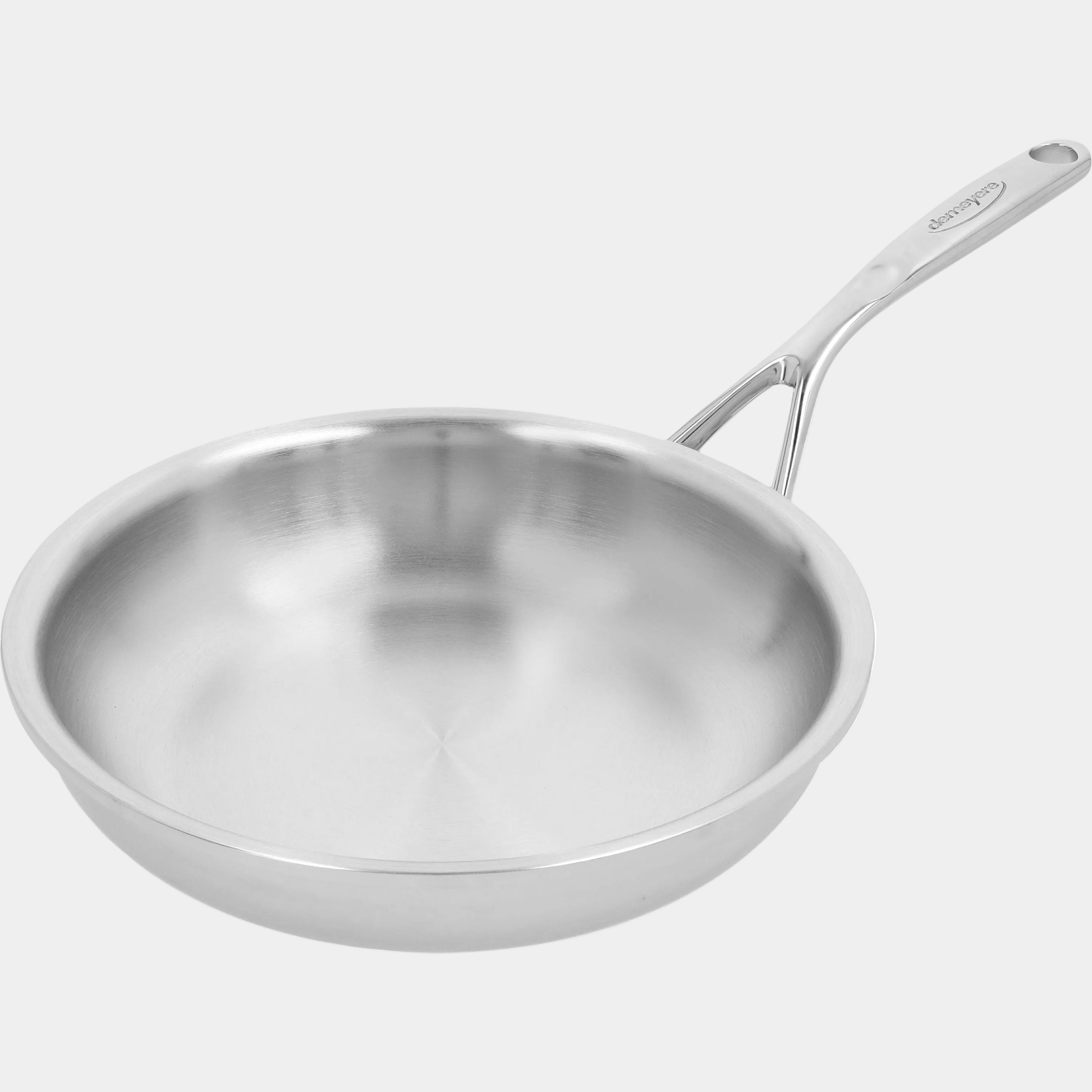 Stainless steel frying pan on a white background