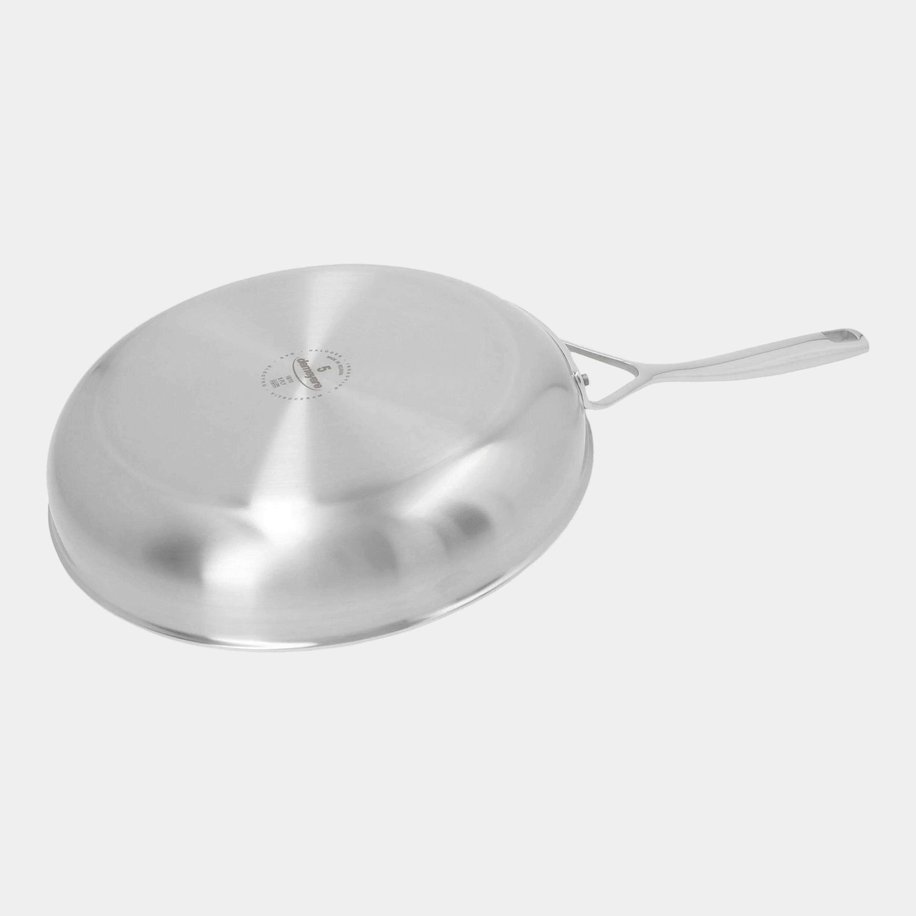 Stainless steel frying pan on a white background