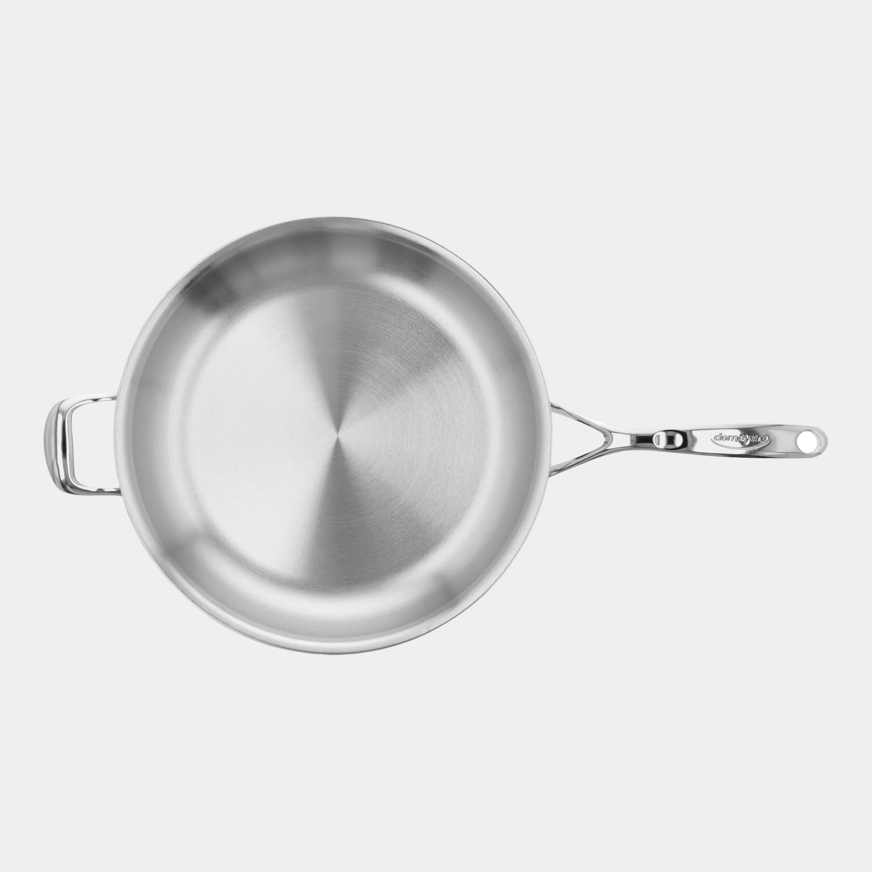 Stainless steel frying pan on a white background