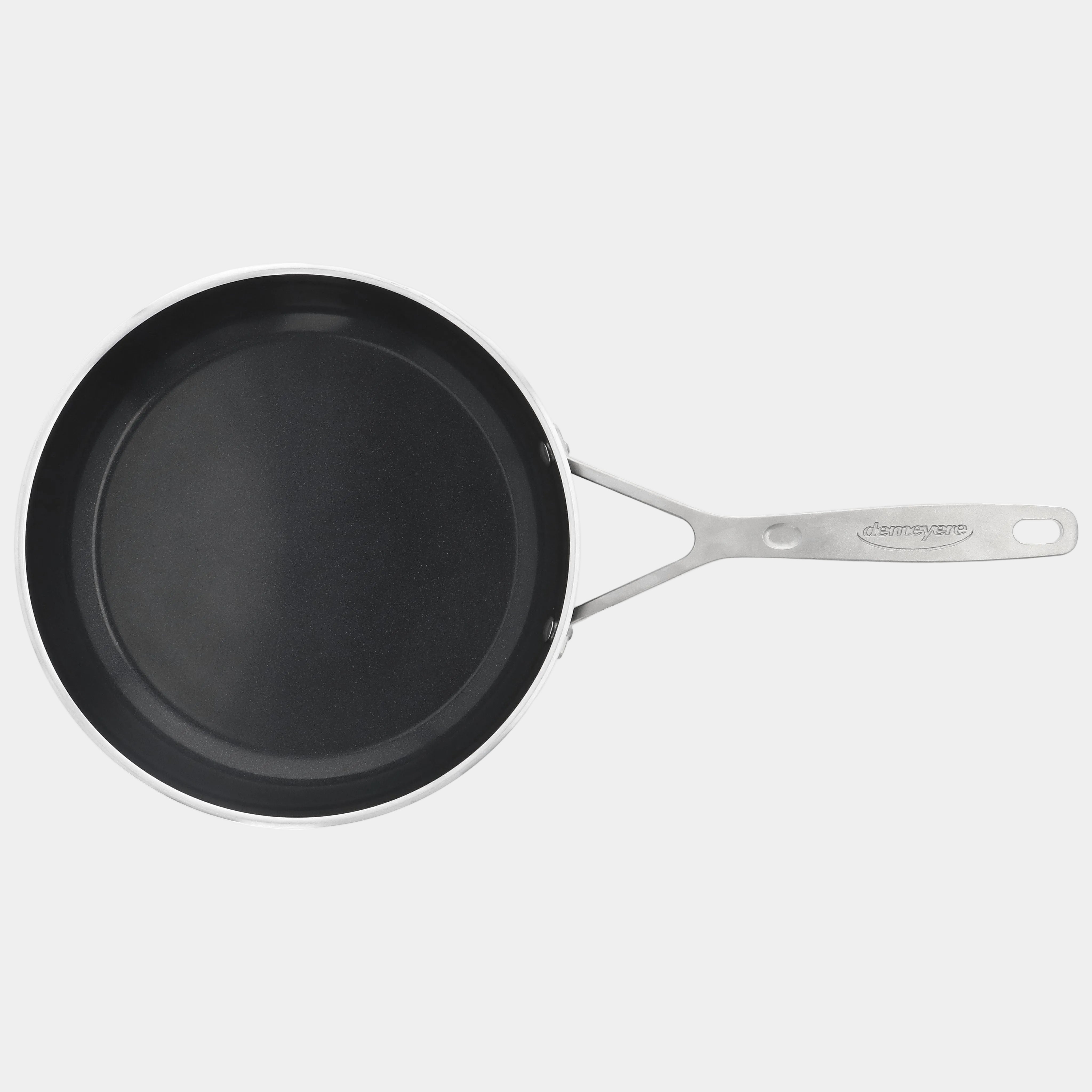 Black frying pan with a silver handle on a white background
