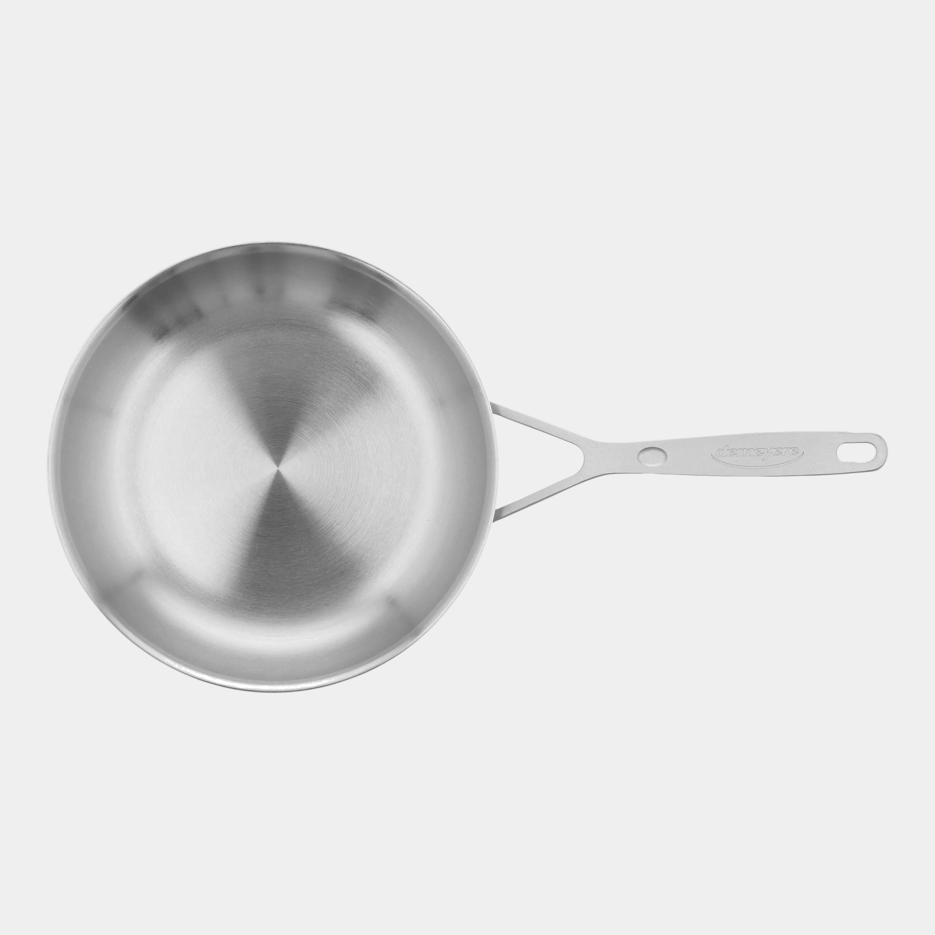 Stainless steel frying pan on a white background
