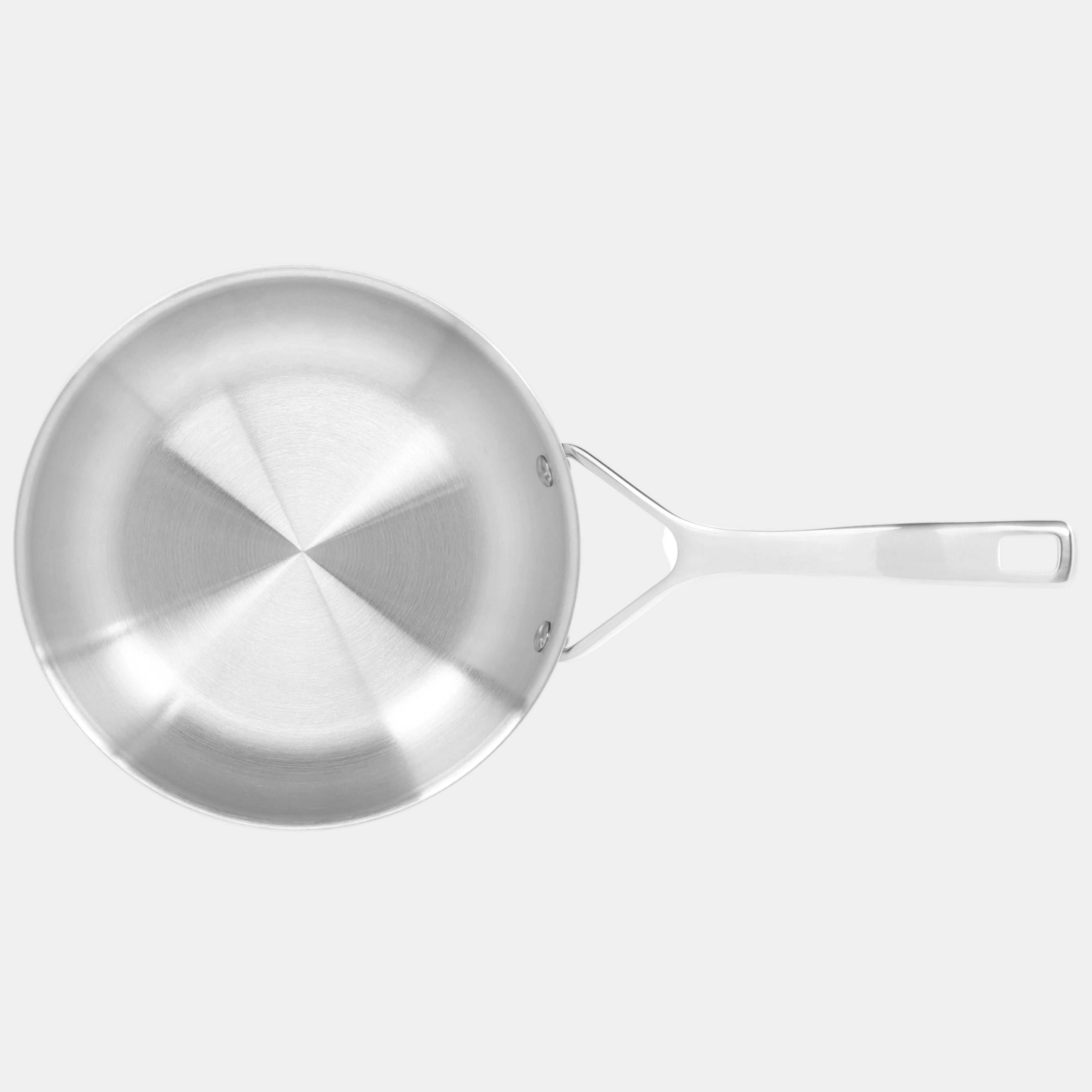 Stainless steel frying pan on a white background