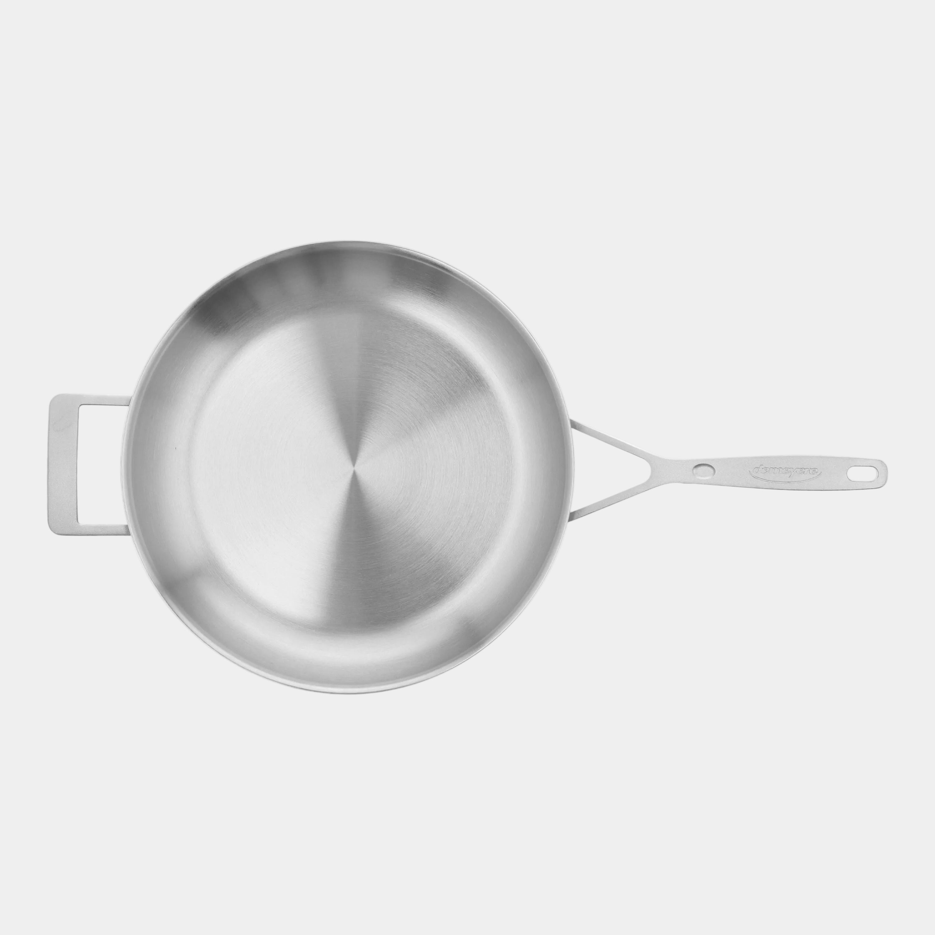 Stainless steel frying pan on a white background