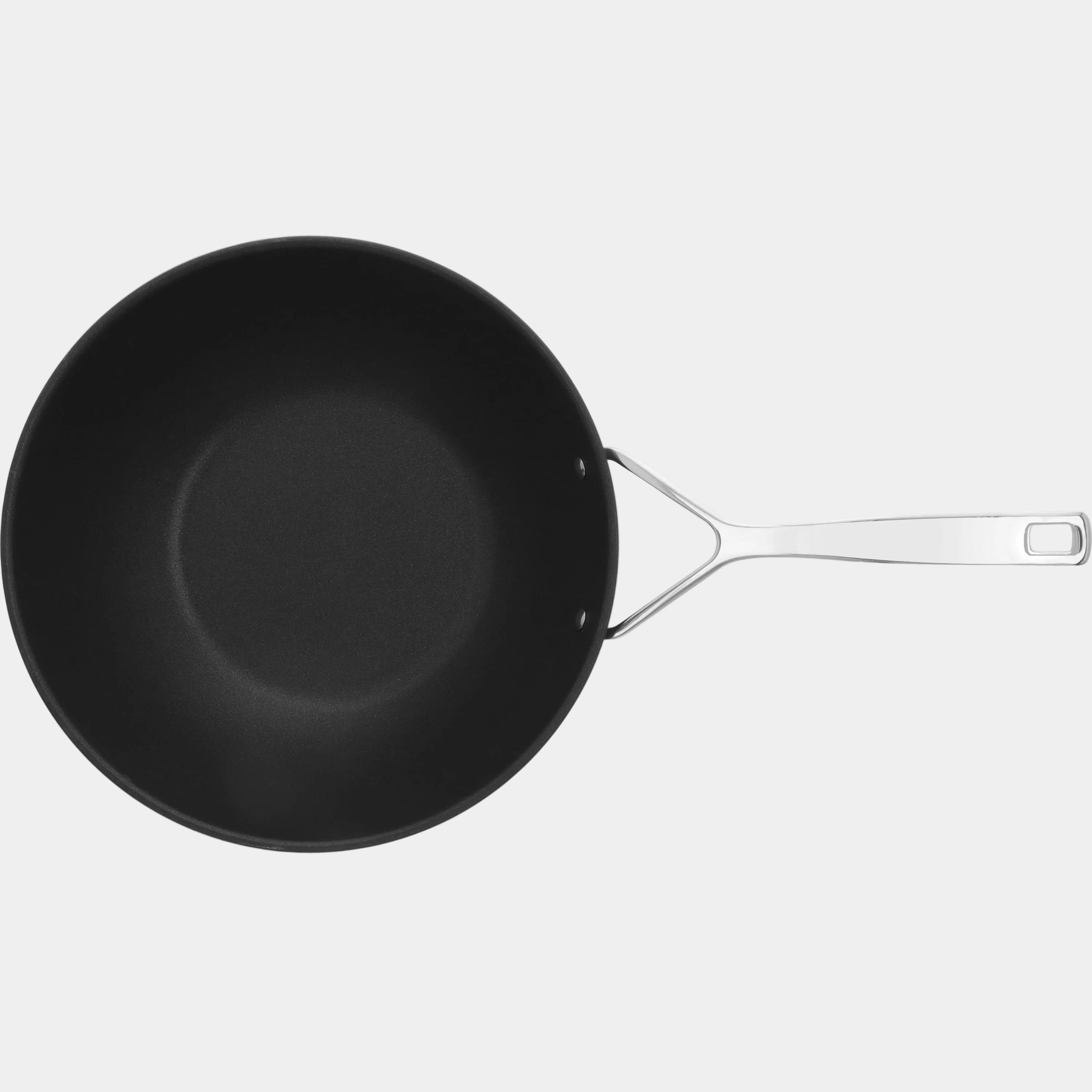 Black frying pan with a white handle on a white background