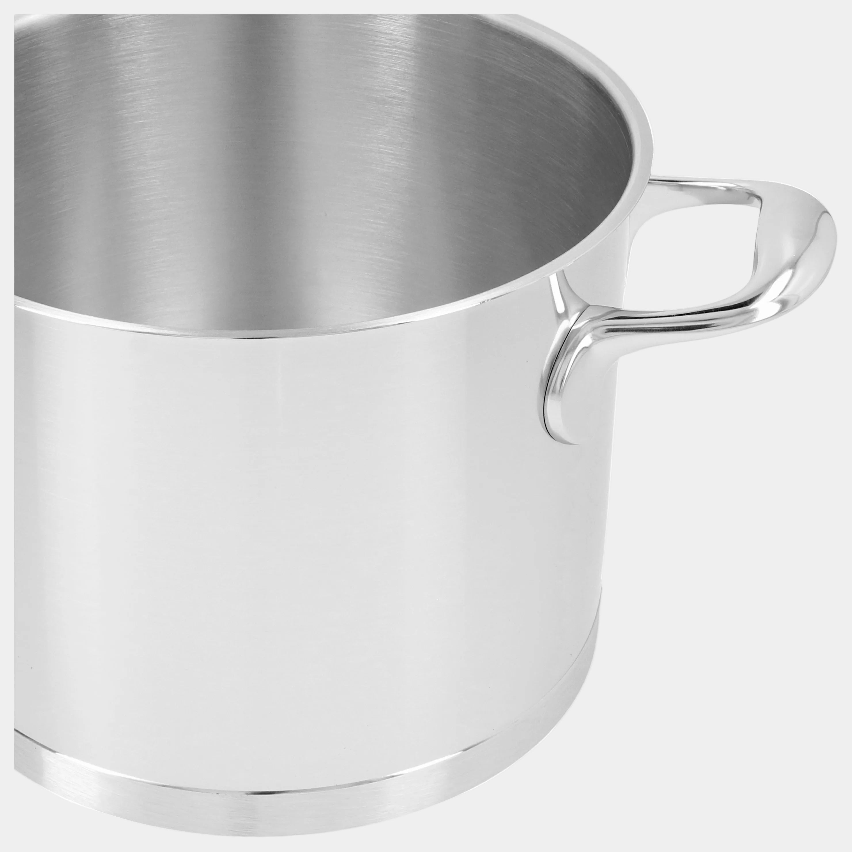 Stainless steel cup with handle on a white background