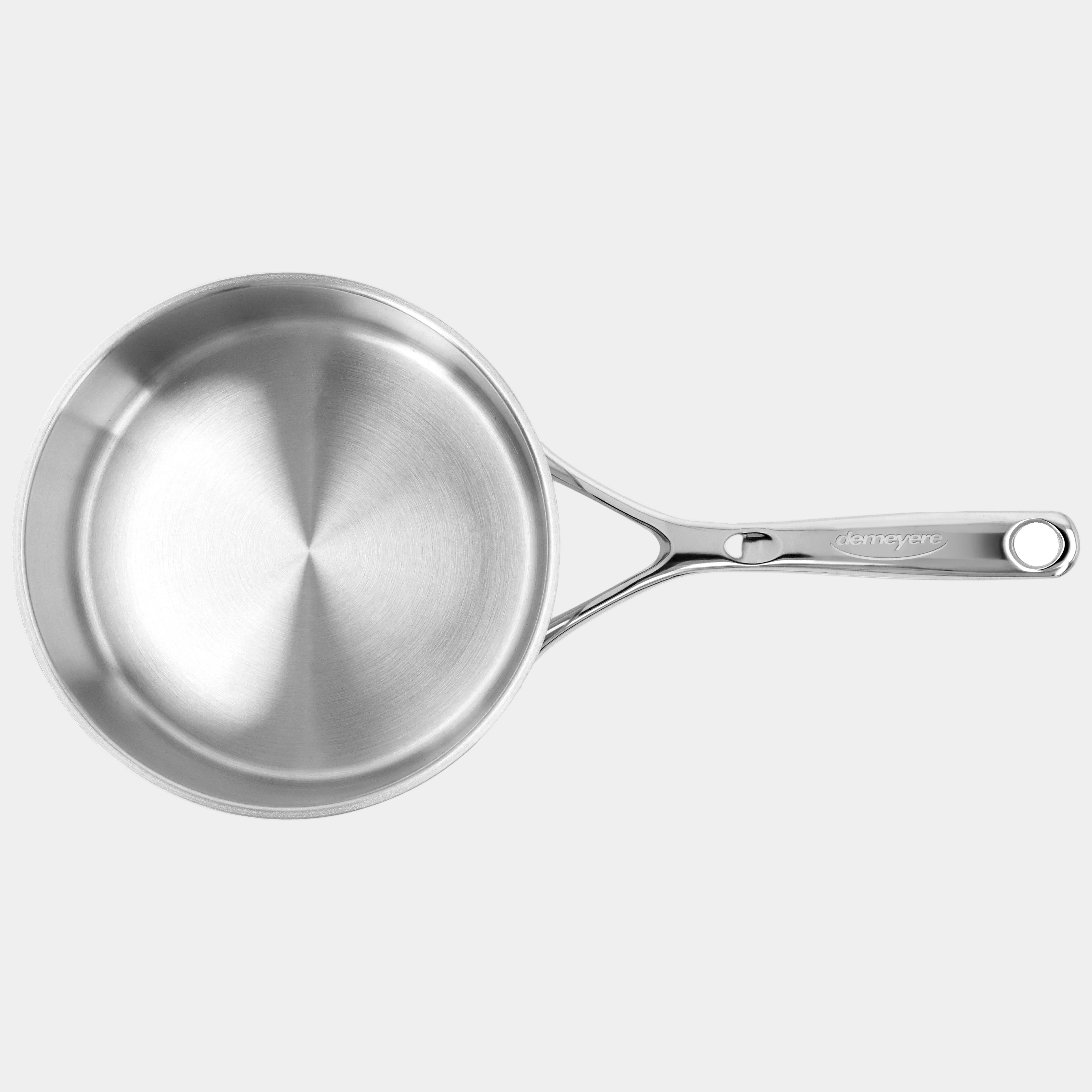 Stainless steel frying pan on a white background
