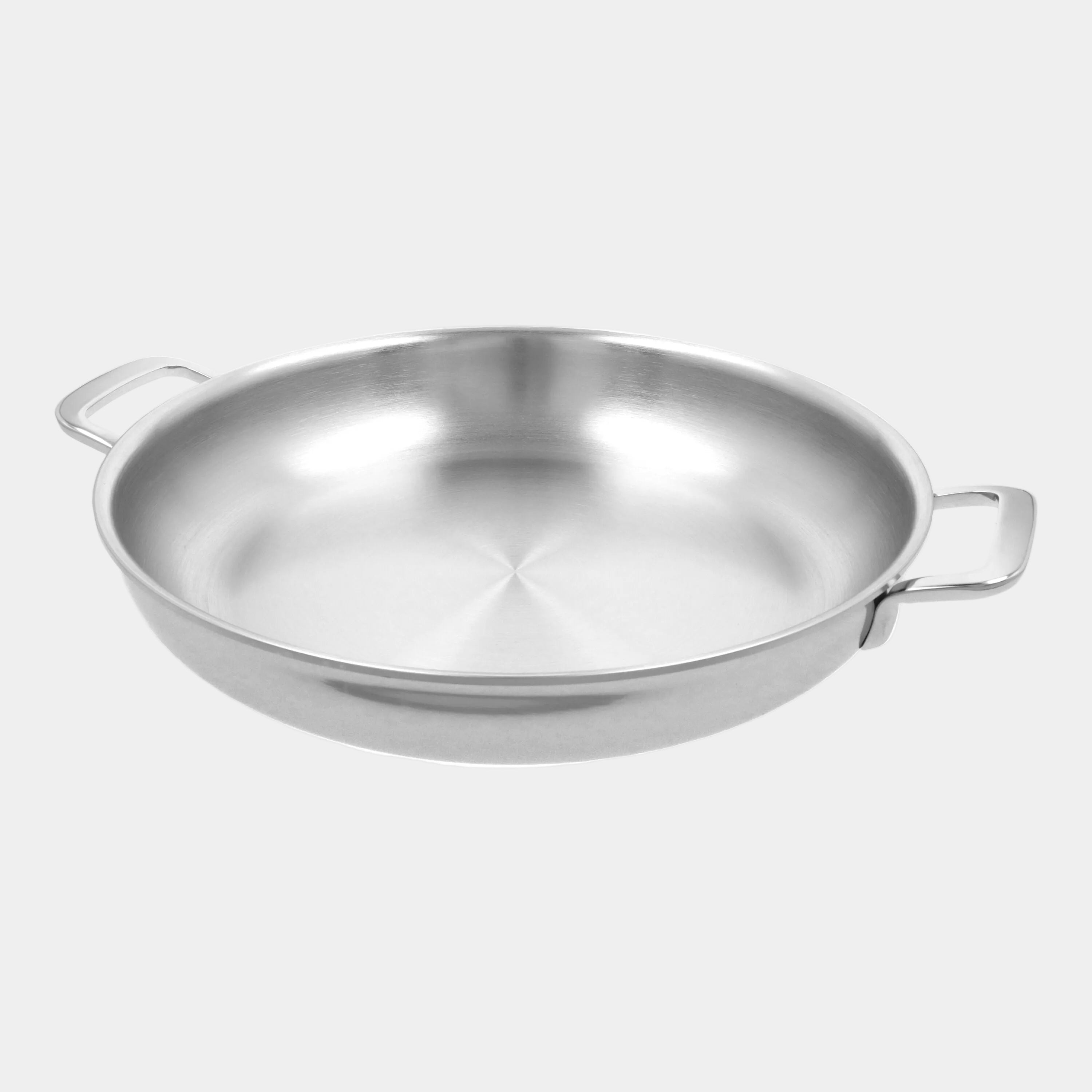 Stainless steel wok with handles on a white background