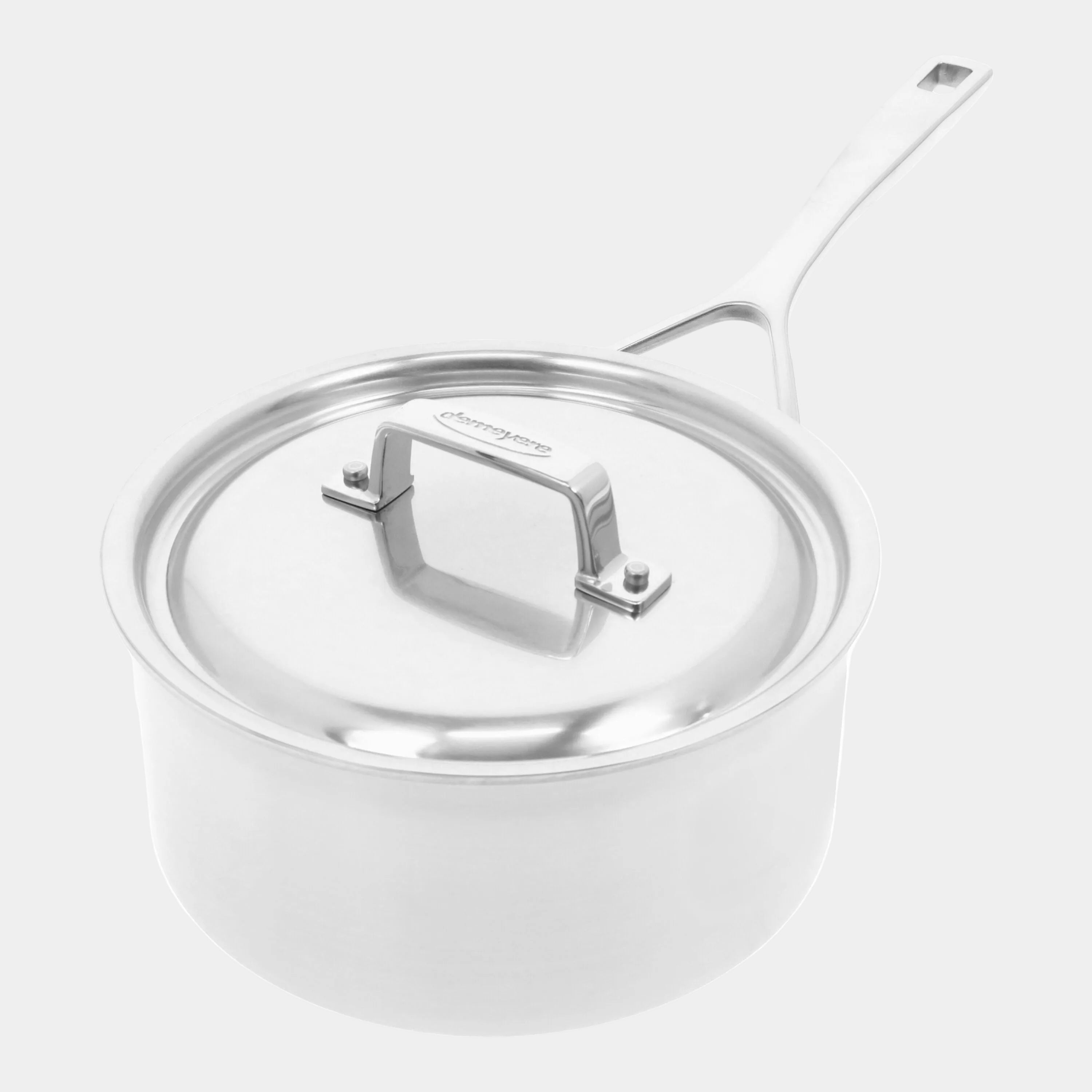 Stainless steel pot with lid on a white background