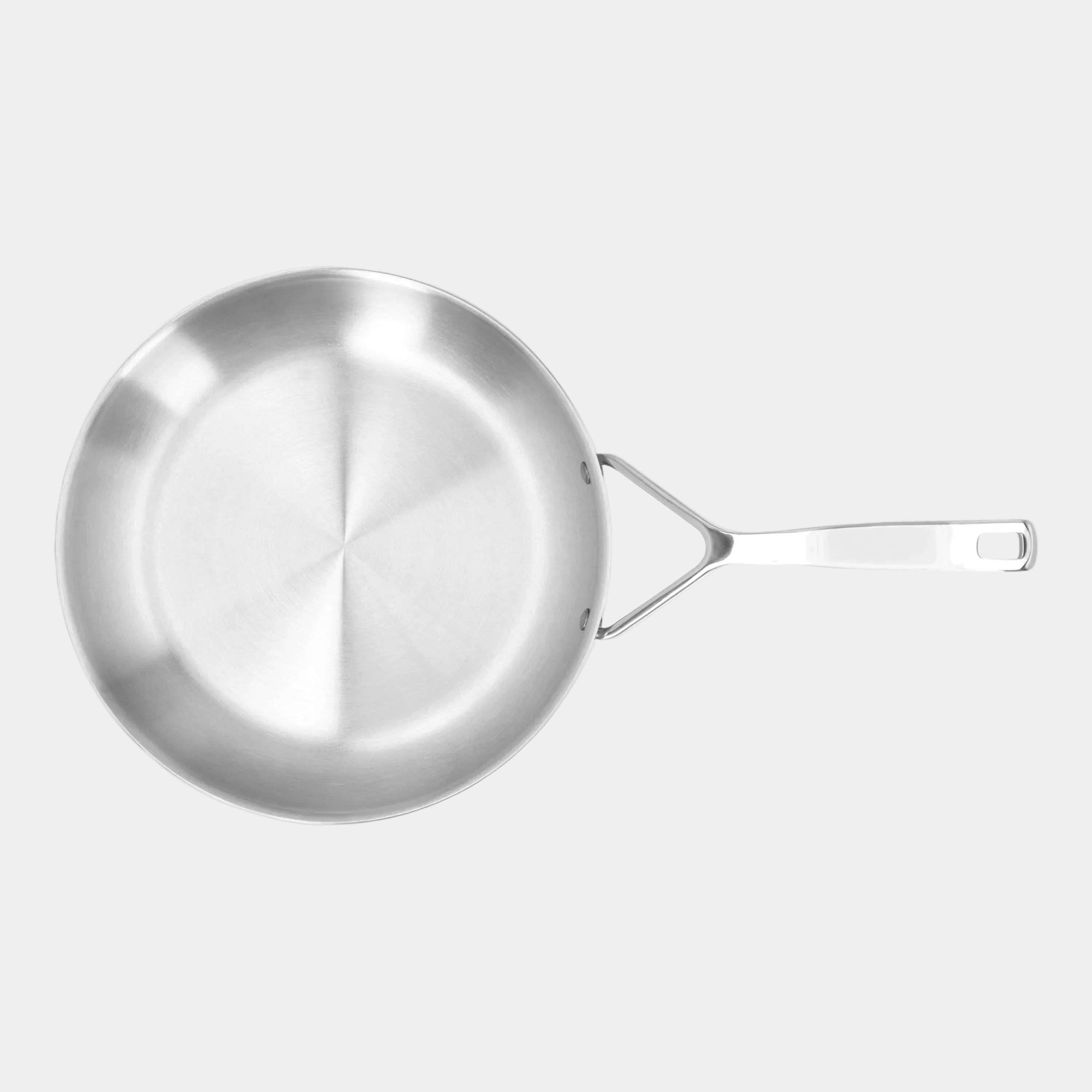 Stainless steel frying pan on a white background