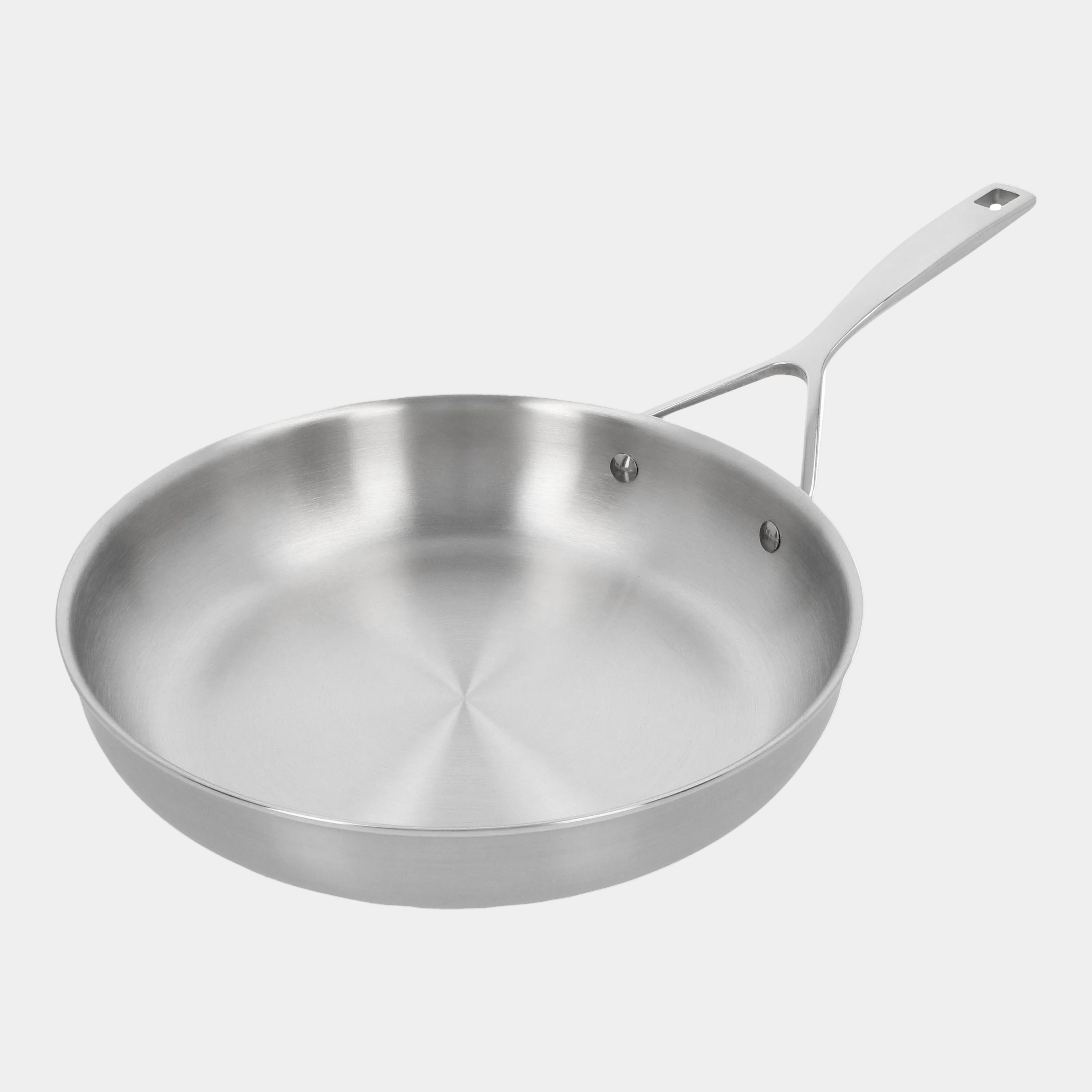 Stainless steel frying pan on a white background