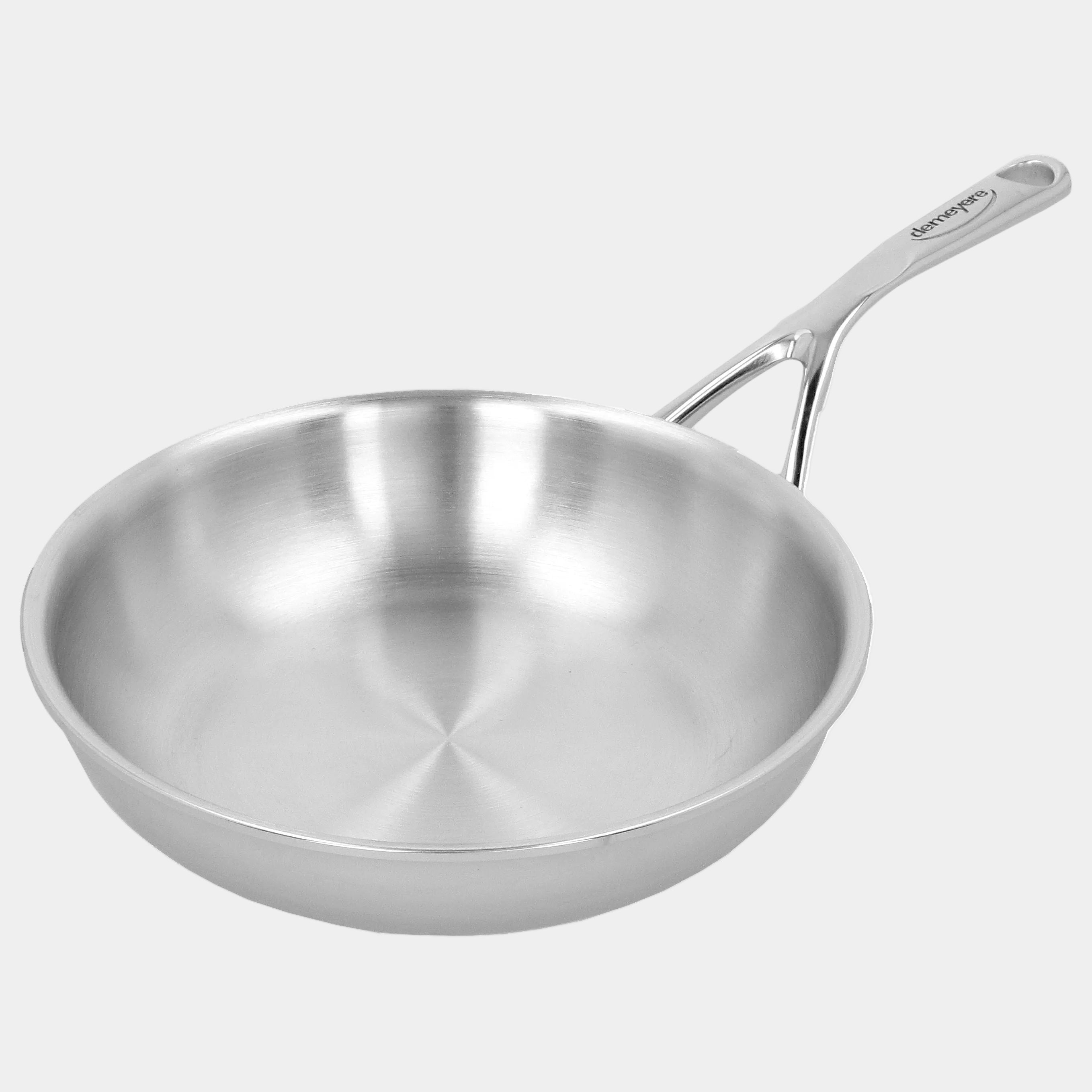 Stainless steel frying pan on a white background