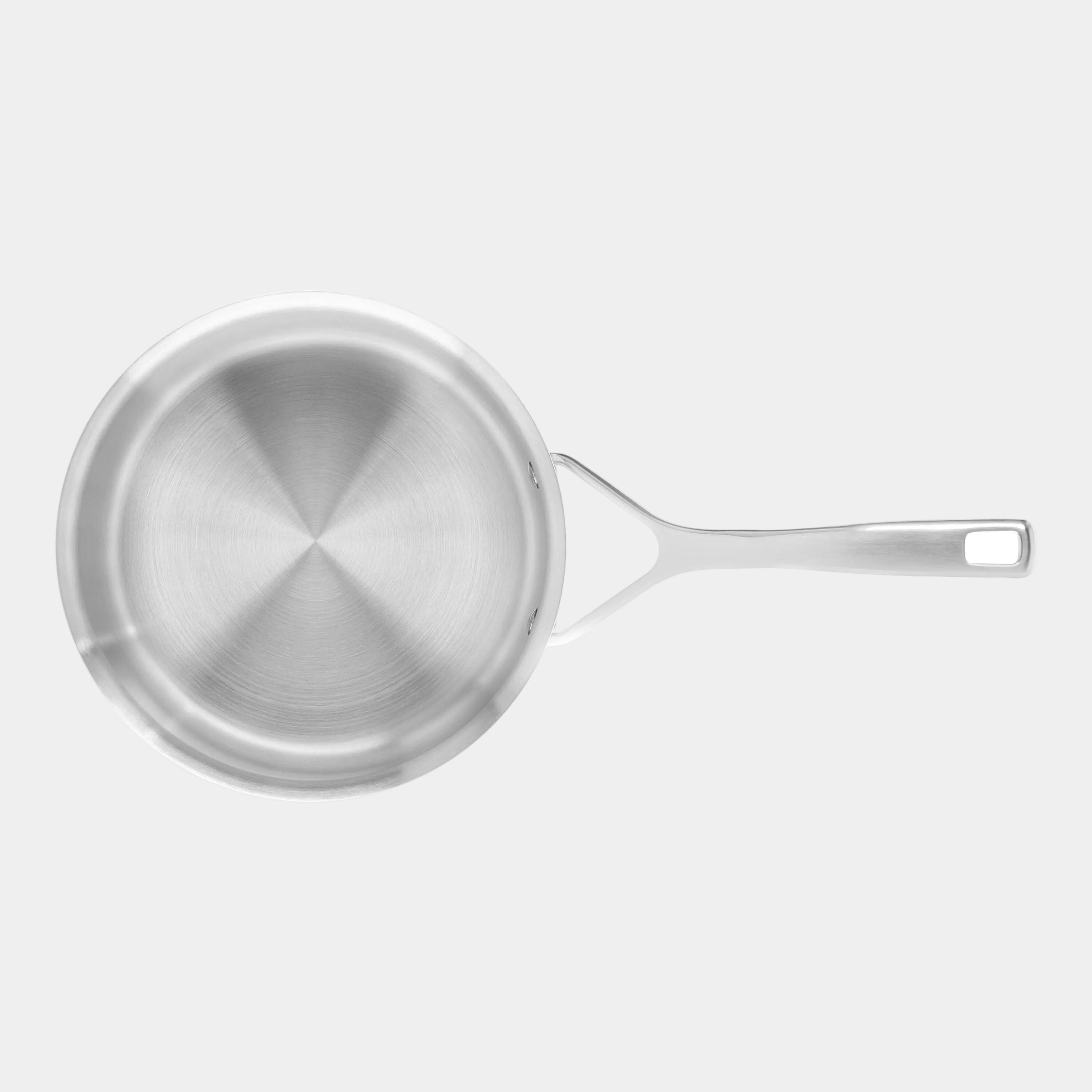 Stainless steel frying pan on a white background