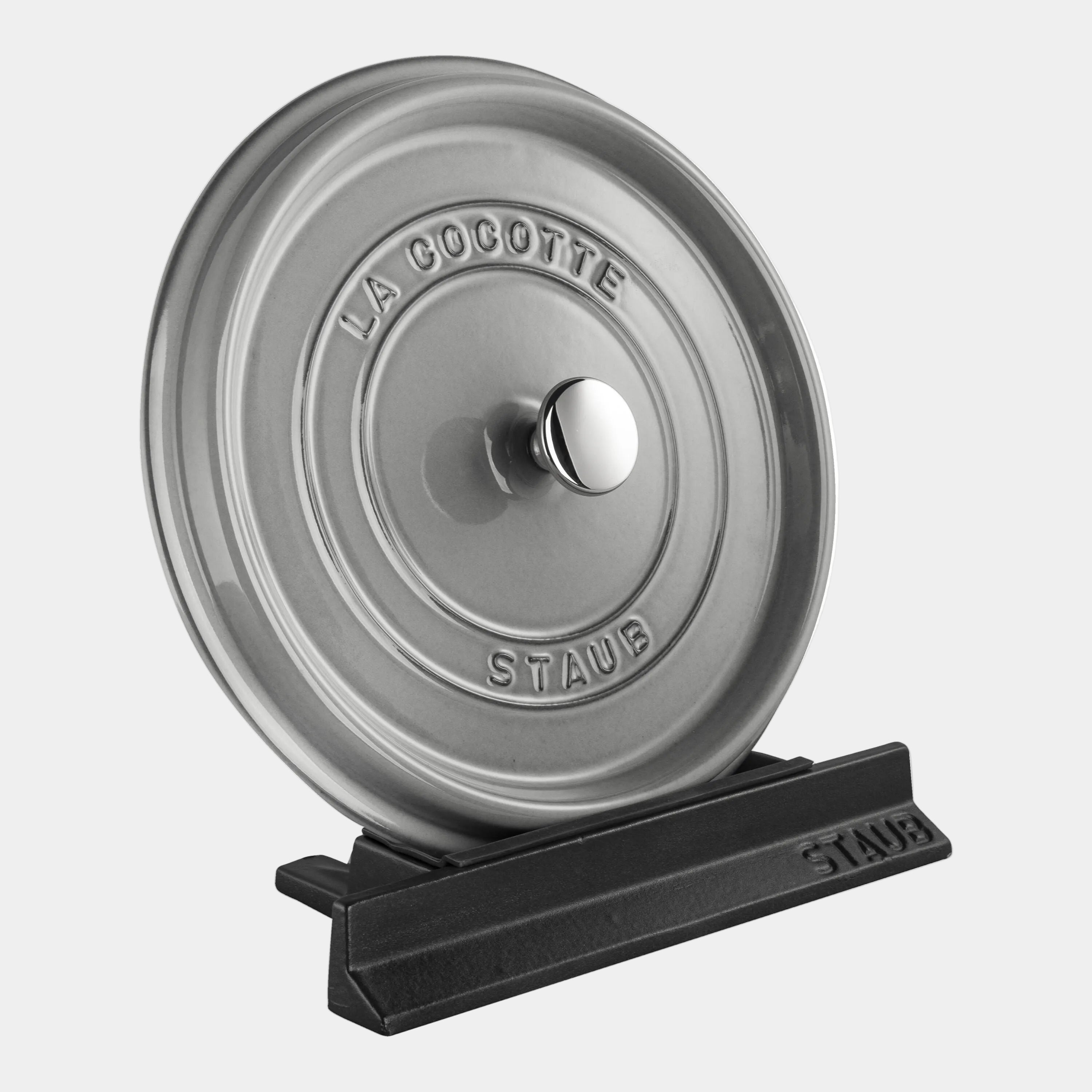 STAUB Cast Iron Lid Holder with cocotte lid, heat-resistant, dishwasher safe, prevents water pooling and scratches, elegant design.