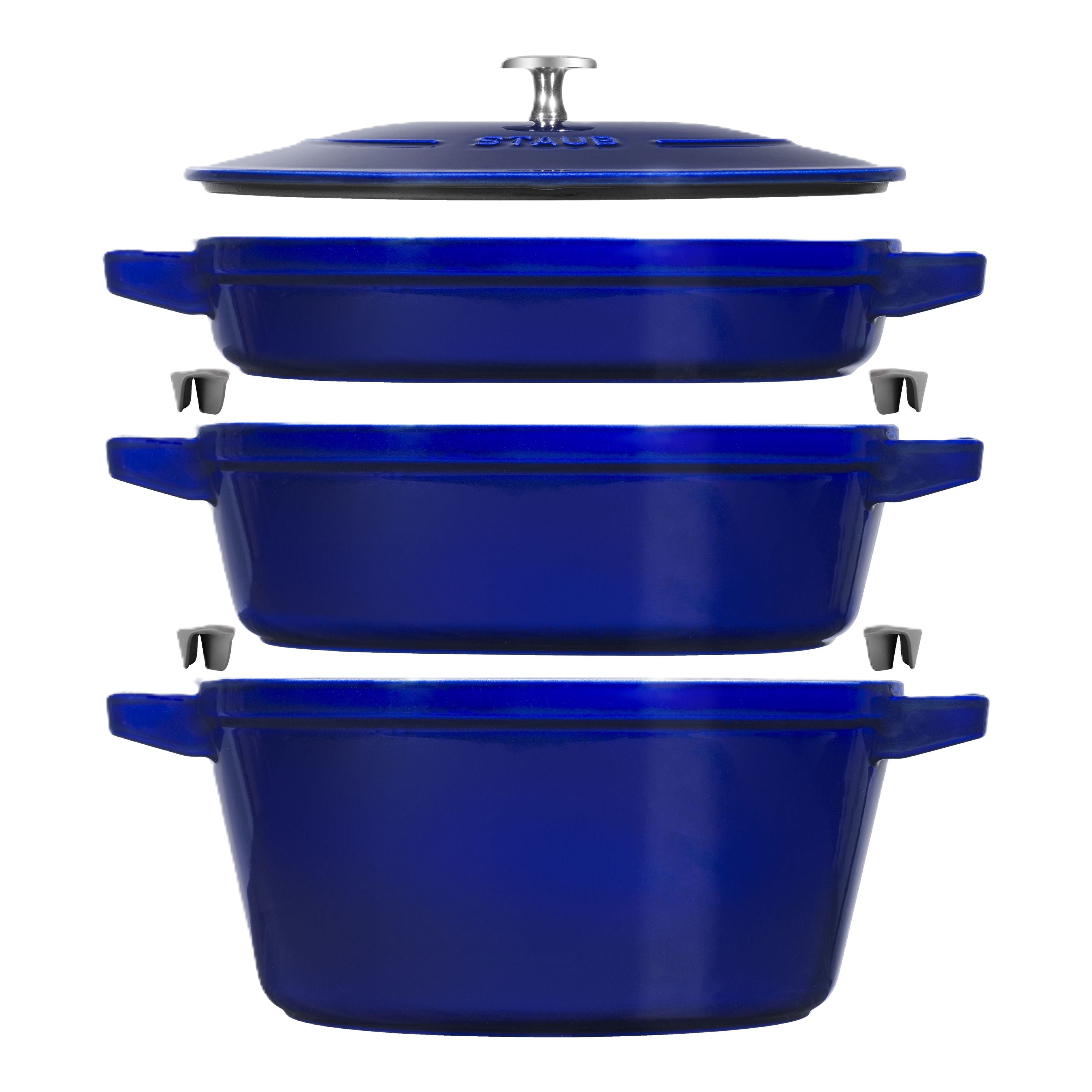 Set of blue cast iron cookware with lids on a white background