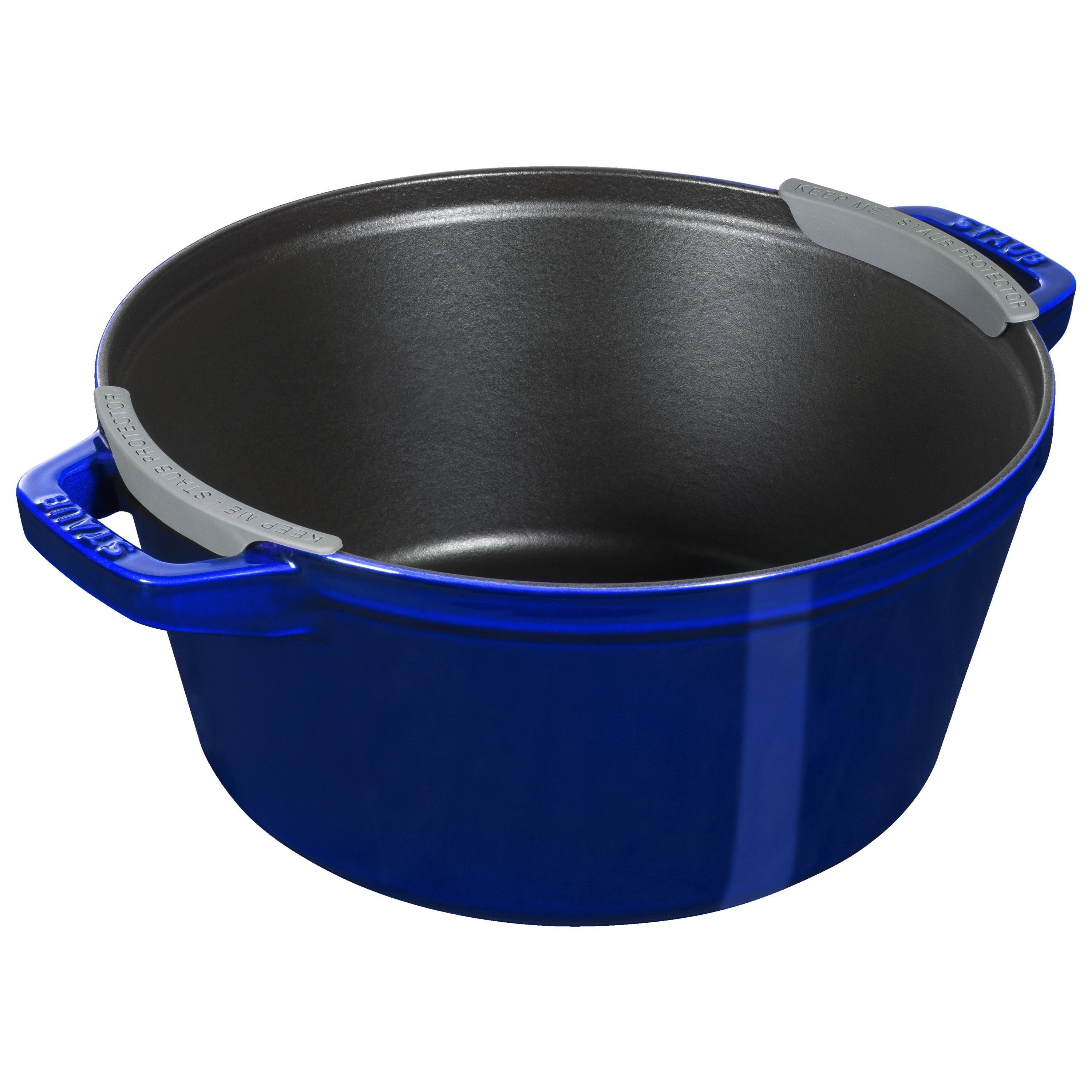 Blue cast iron pot with a lid on a white background