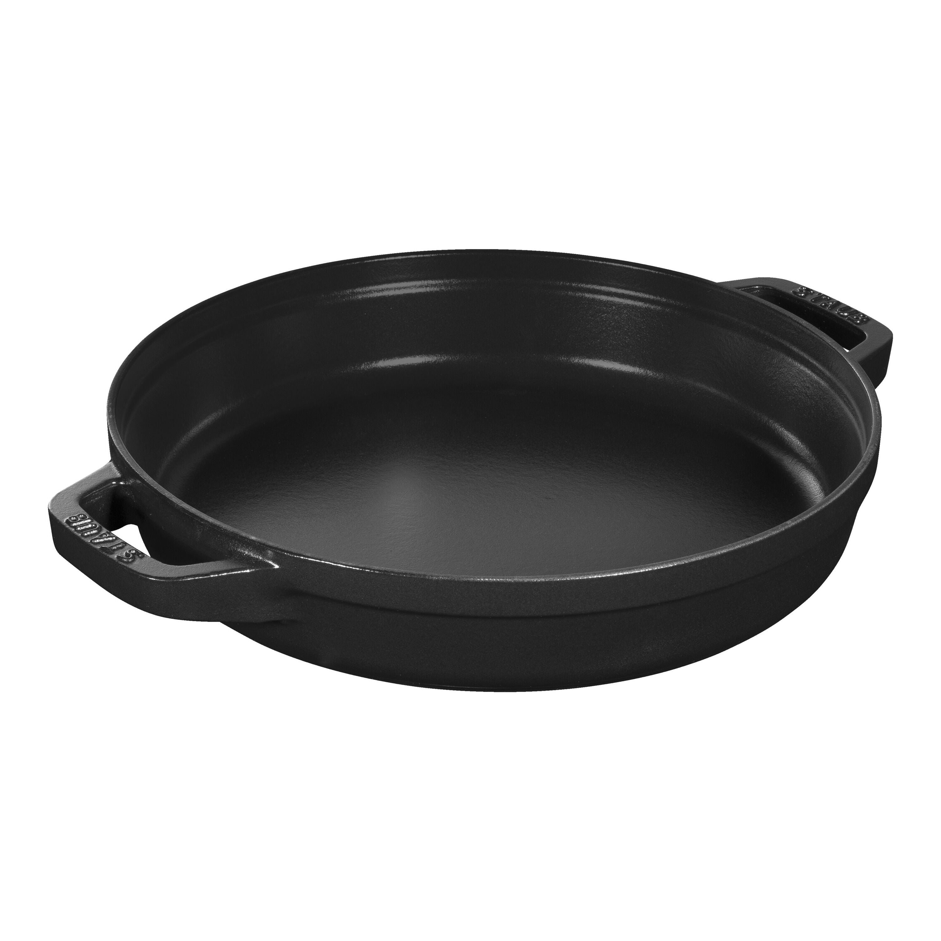 Black cast iron skillet on a white background
