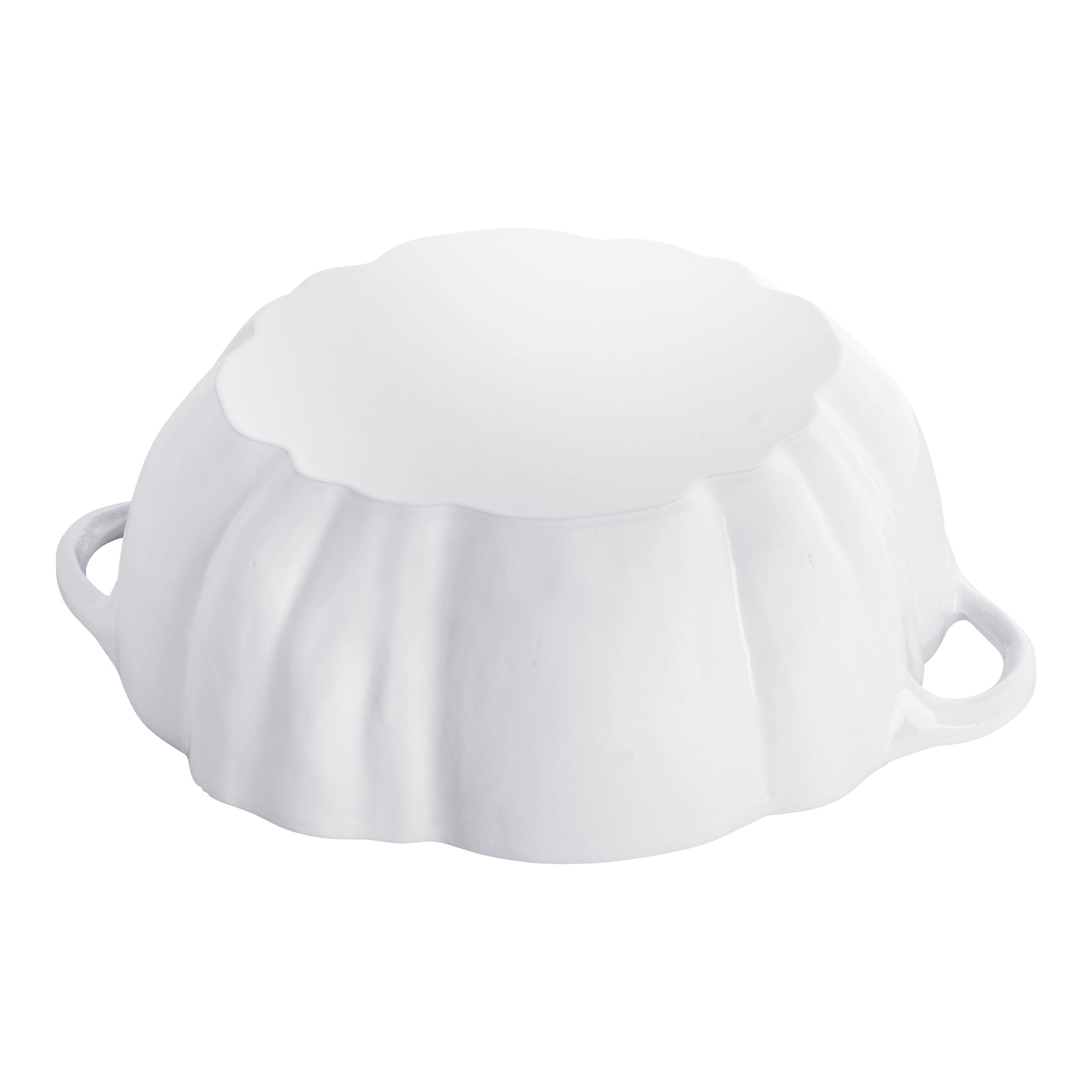 White ceramic shell-shaped dish on a white background