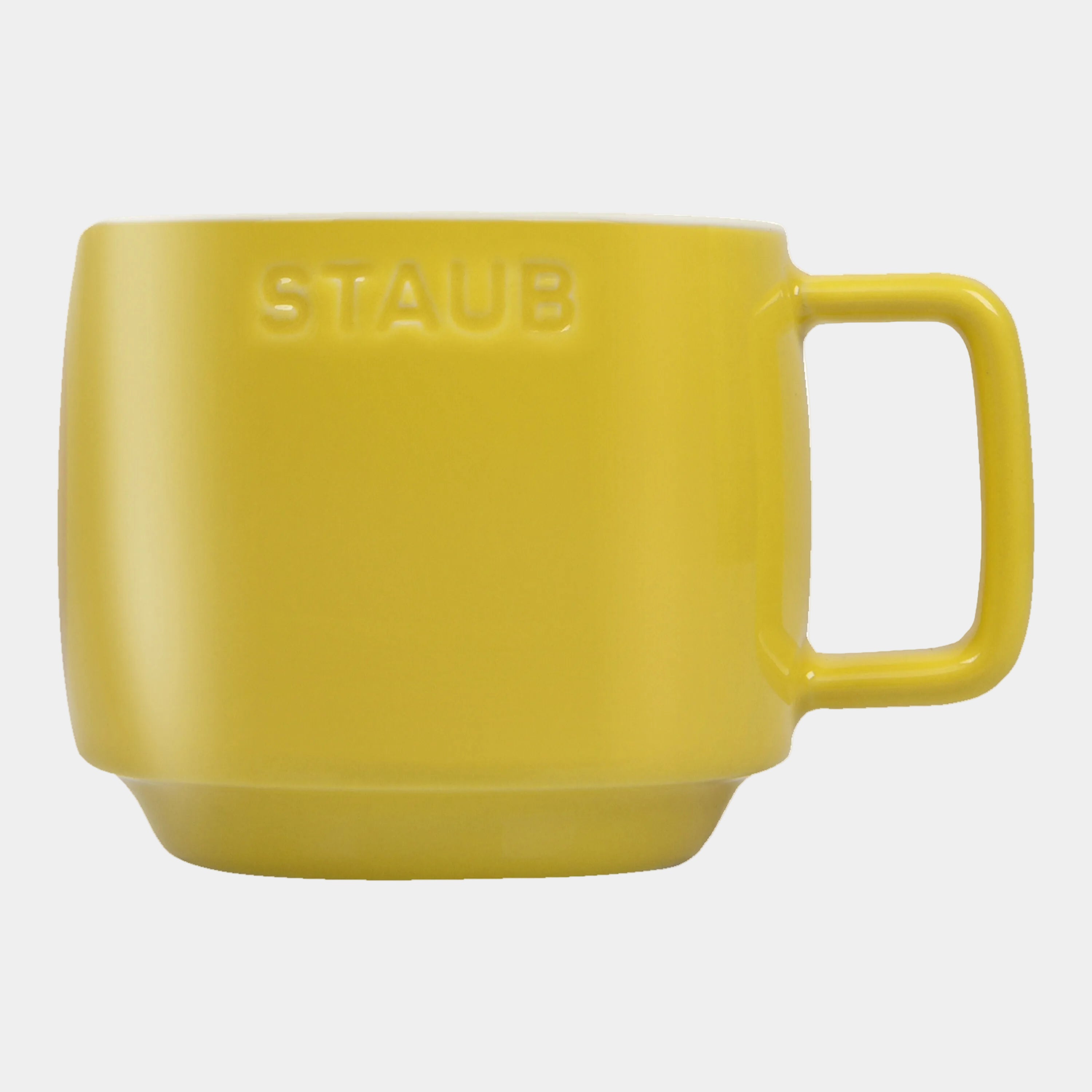 Yellow mug with 'STAUB' branding on a white background
