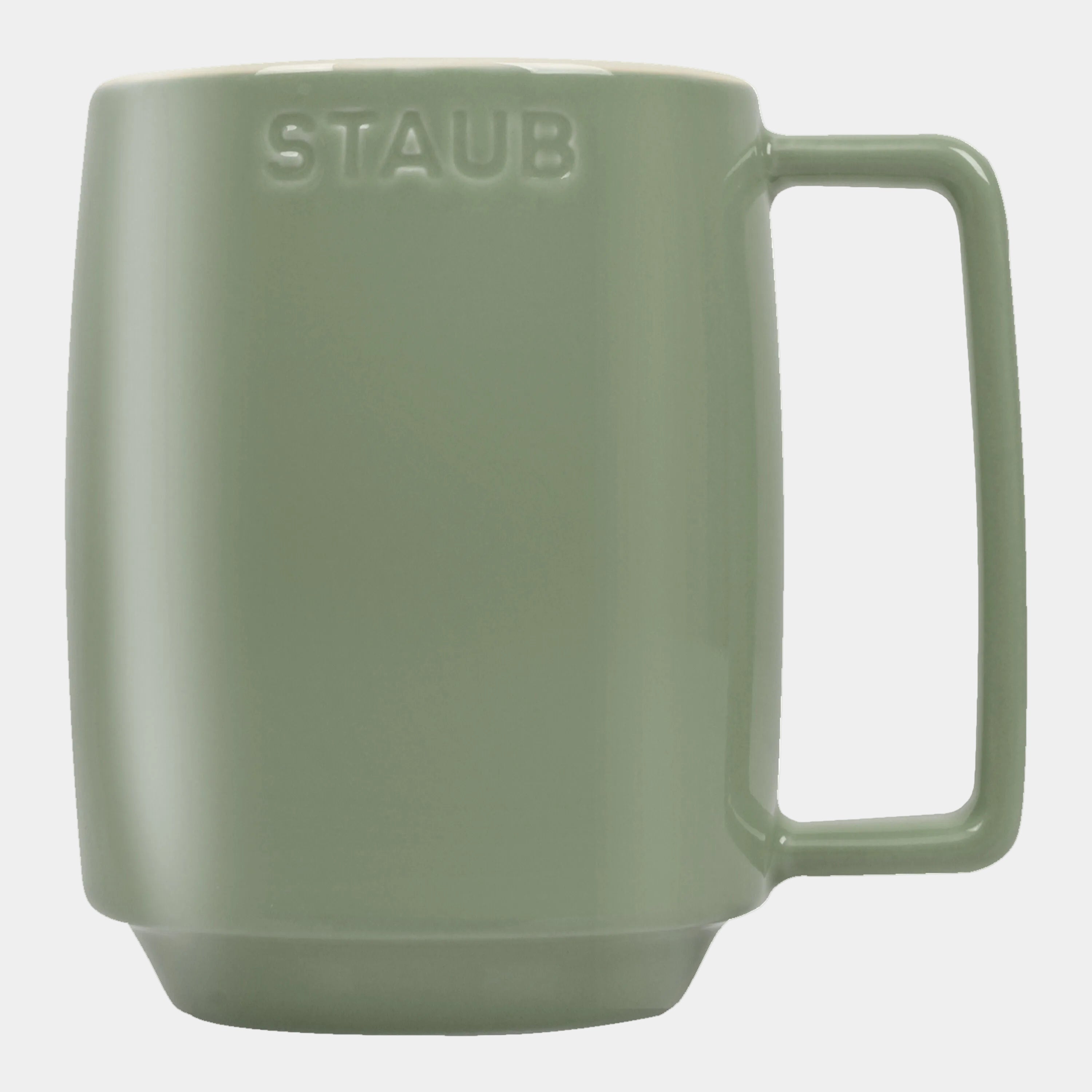 Green mug with 'STAUB' branding on a white background