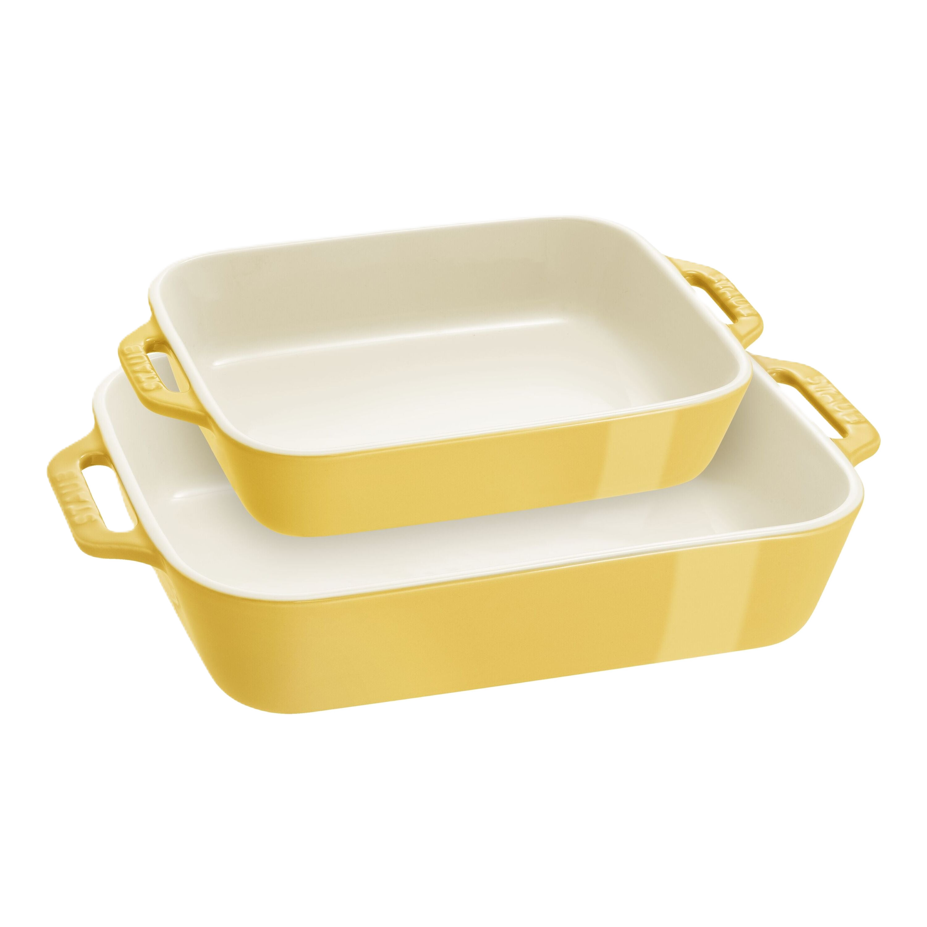 Set of two yellow ceramic baking dishes on a white background
