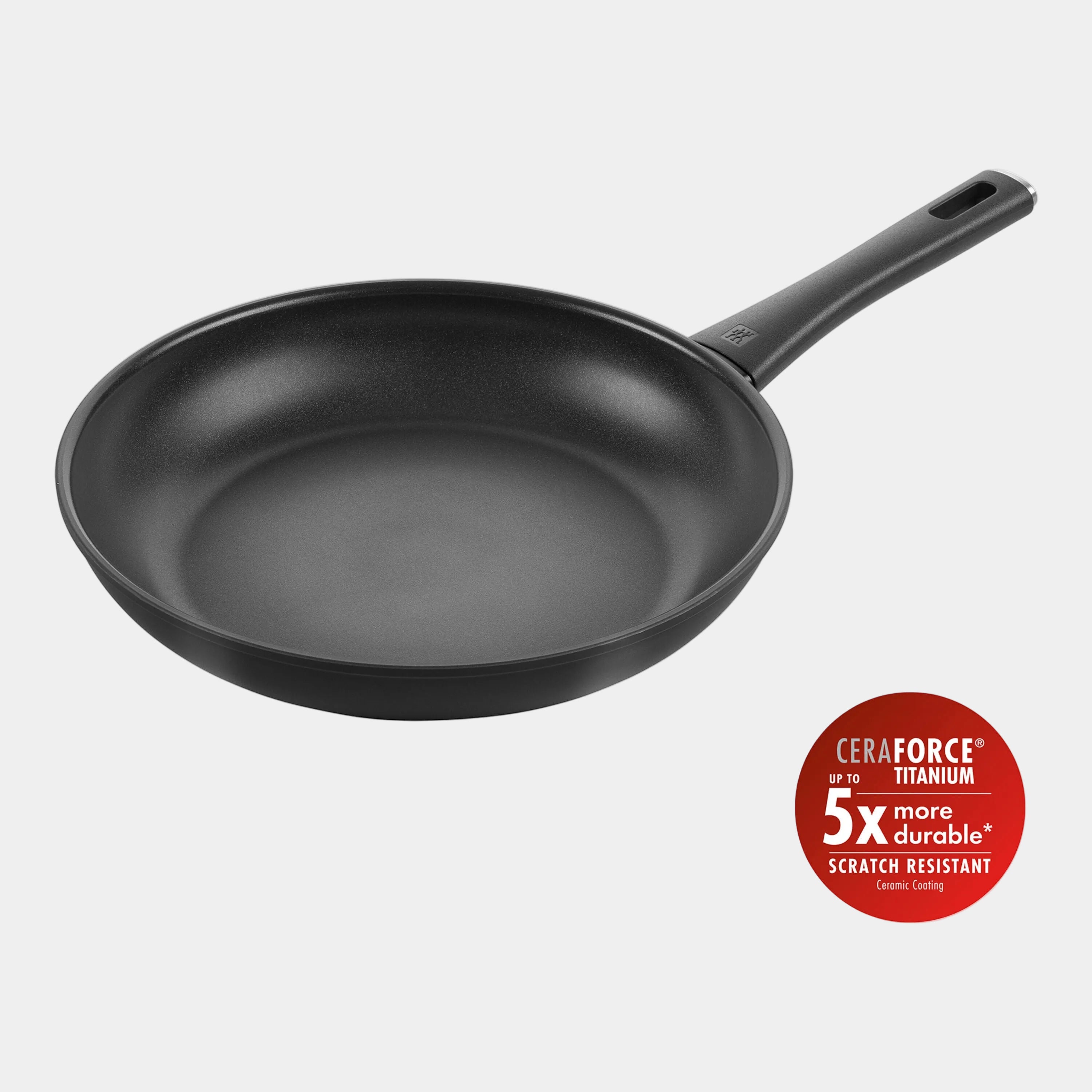 Black frying pan with CeraForce Titanium feature on a white background