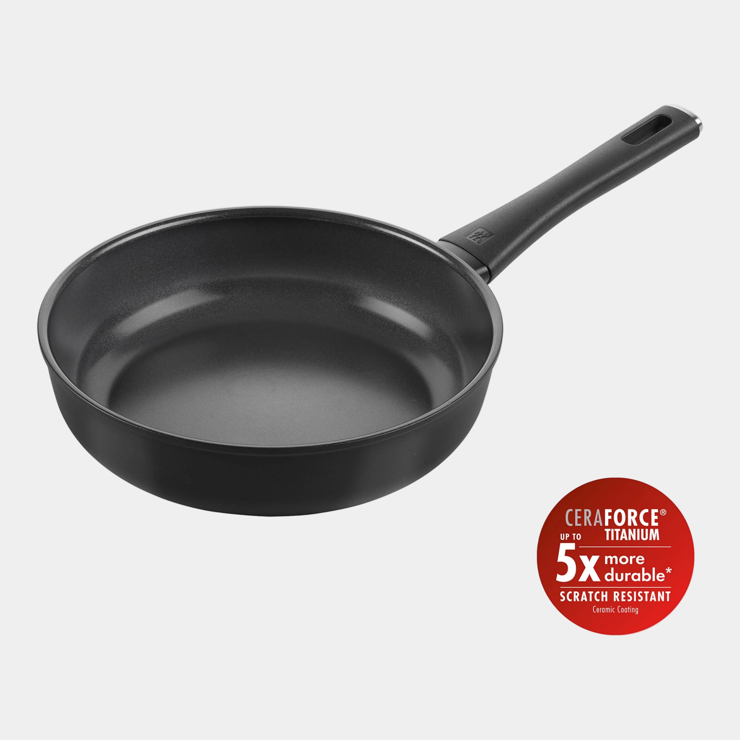 Black frying pan with CeraForce Titanium feature on a white background