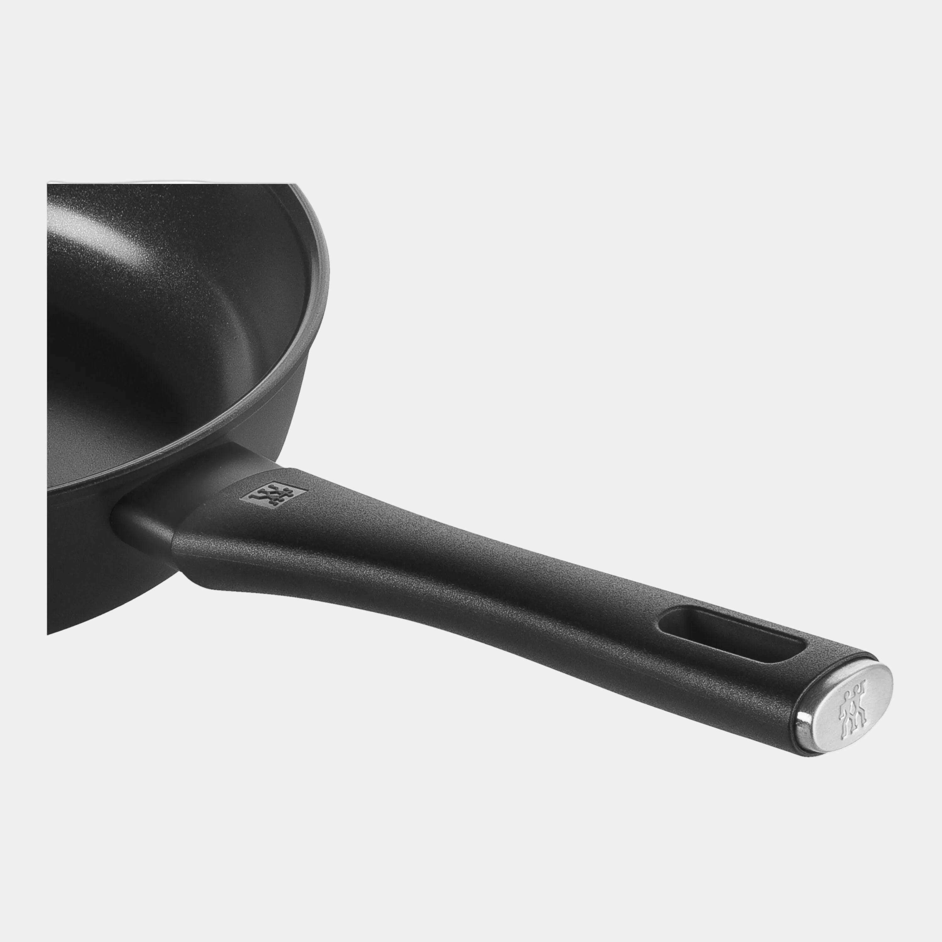 Black frying pan with handle on a white background