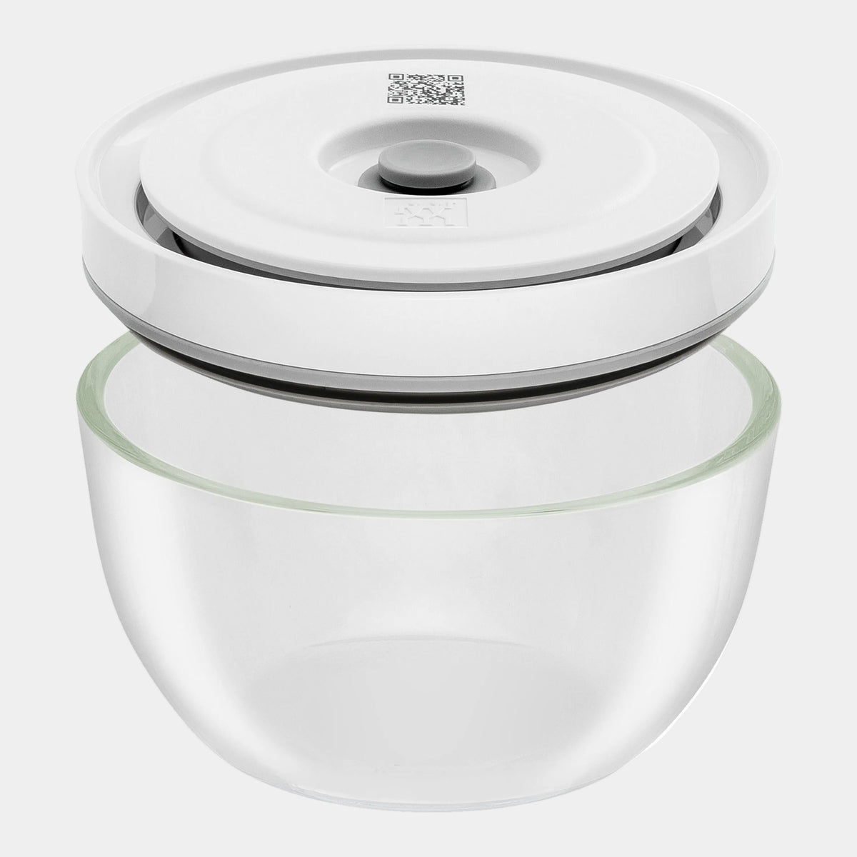 Glass container with a white lid on a white background