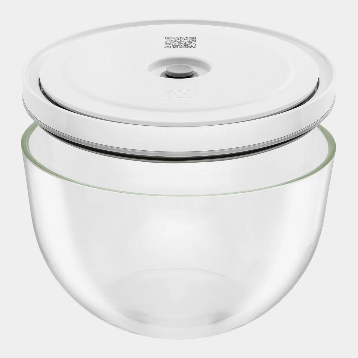 Clear glass container with a white lid on a white background