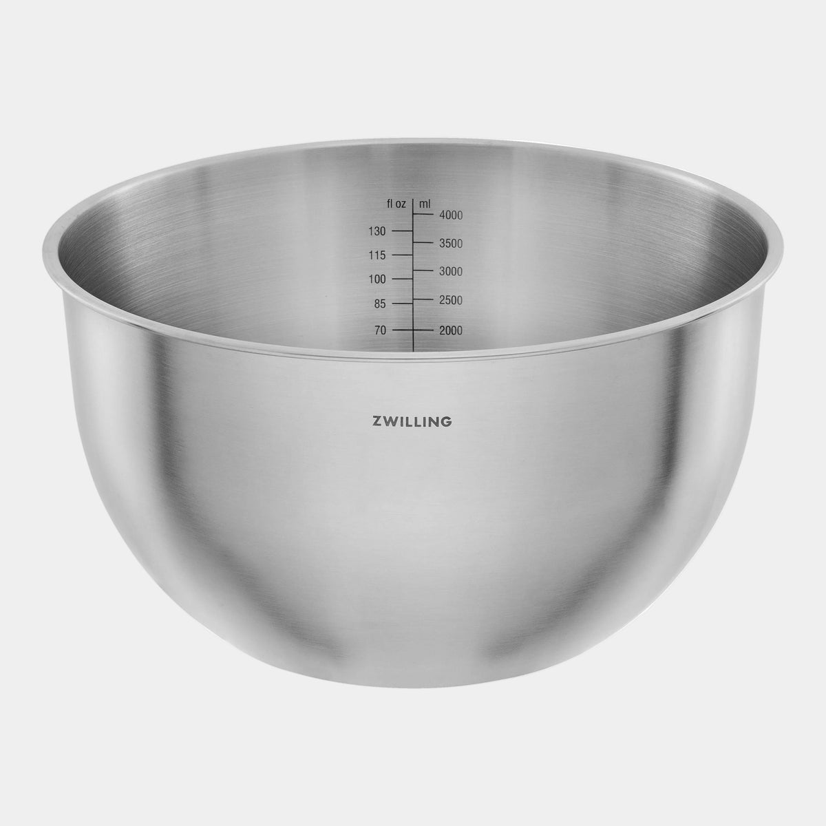 Stainless steel mixing bowl with measurement markings on a white background