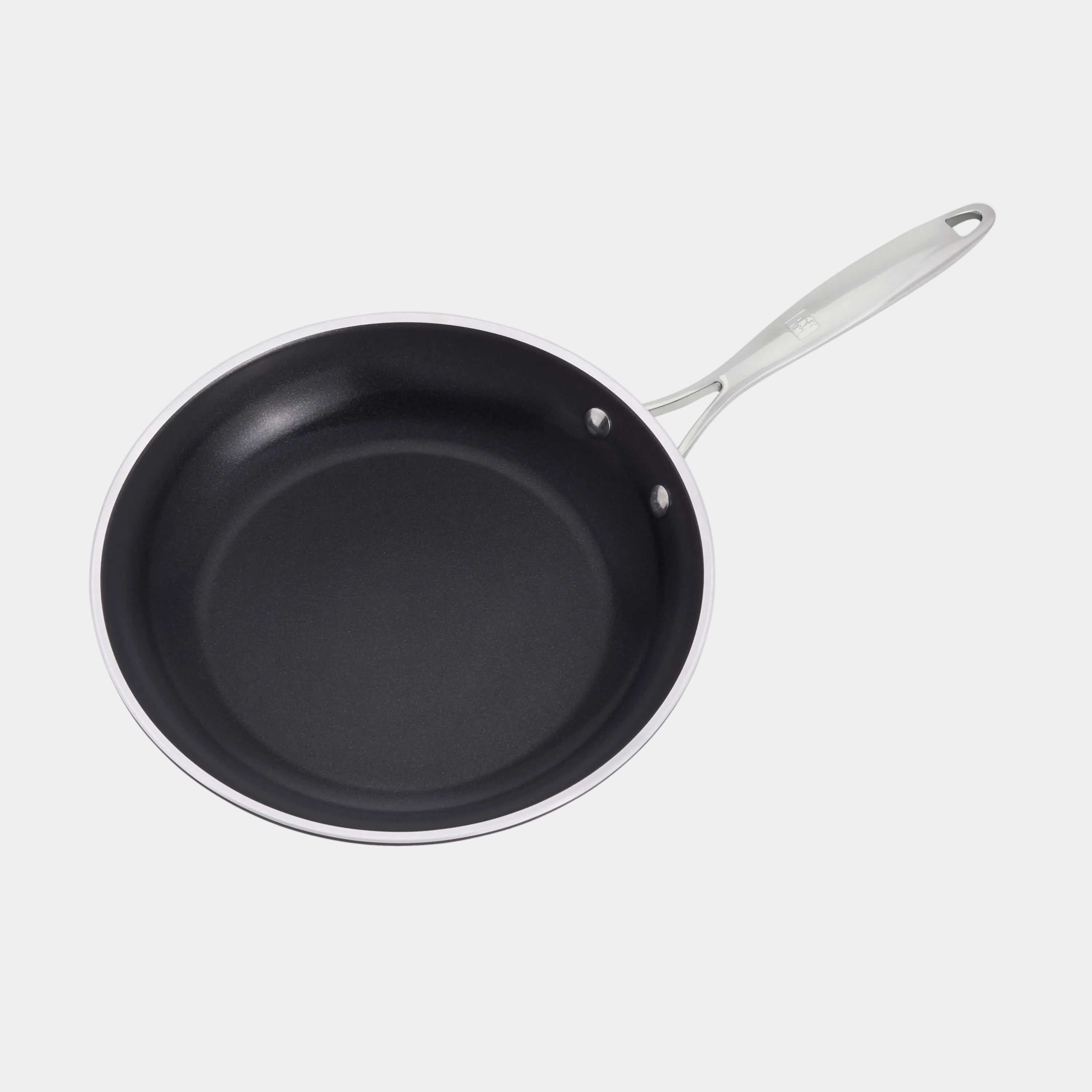 Black frying pan with a silver handle on a white background