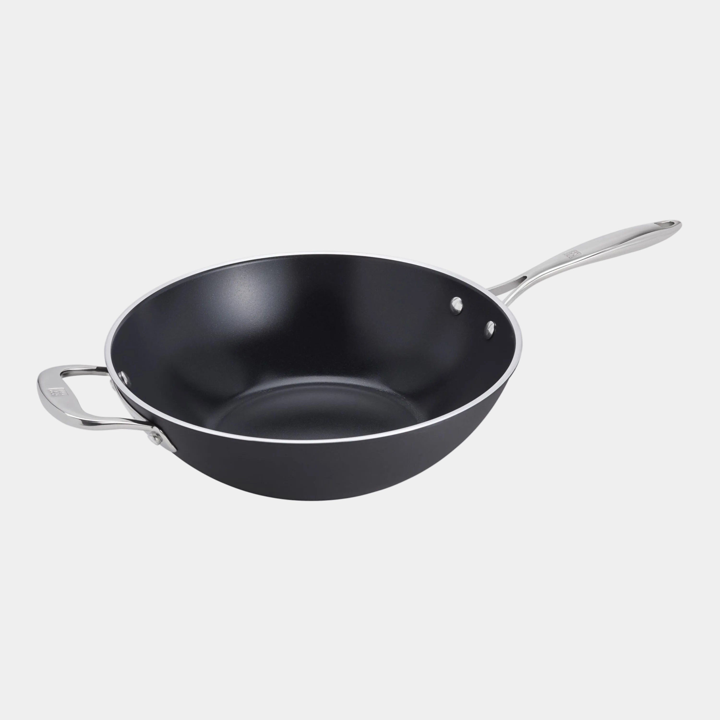 Black wok with silver handles on a white background