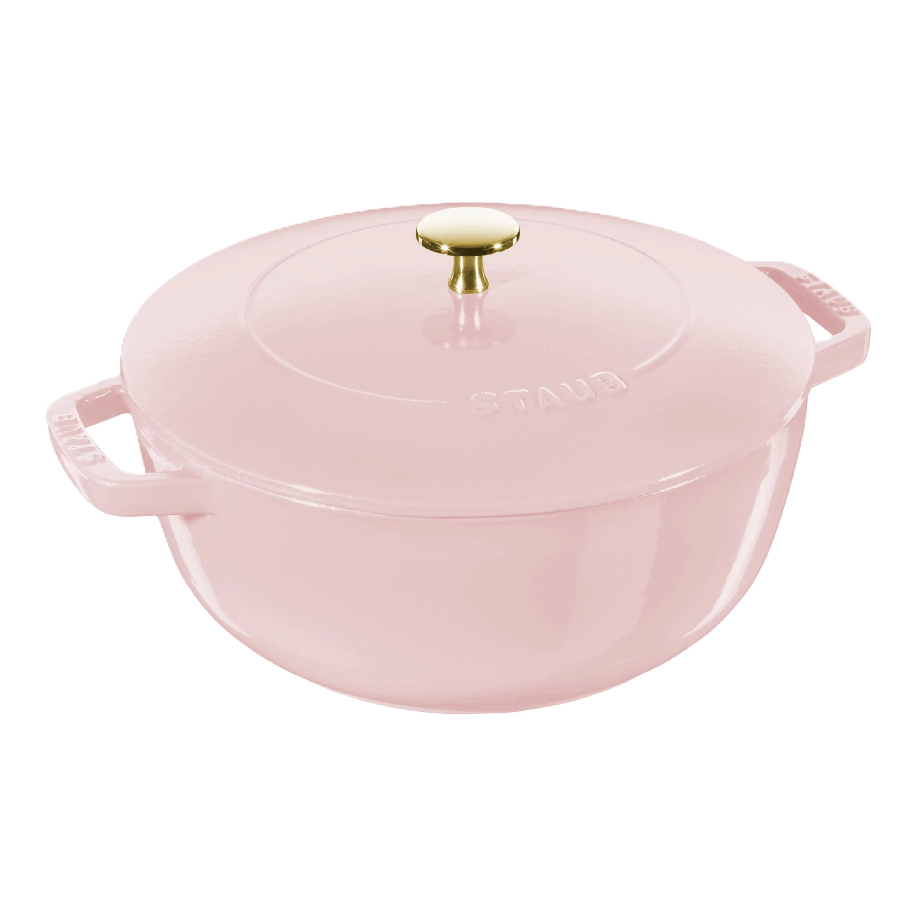 Pink Staub cocotte with a gold knob on a white background