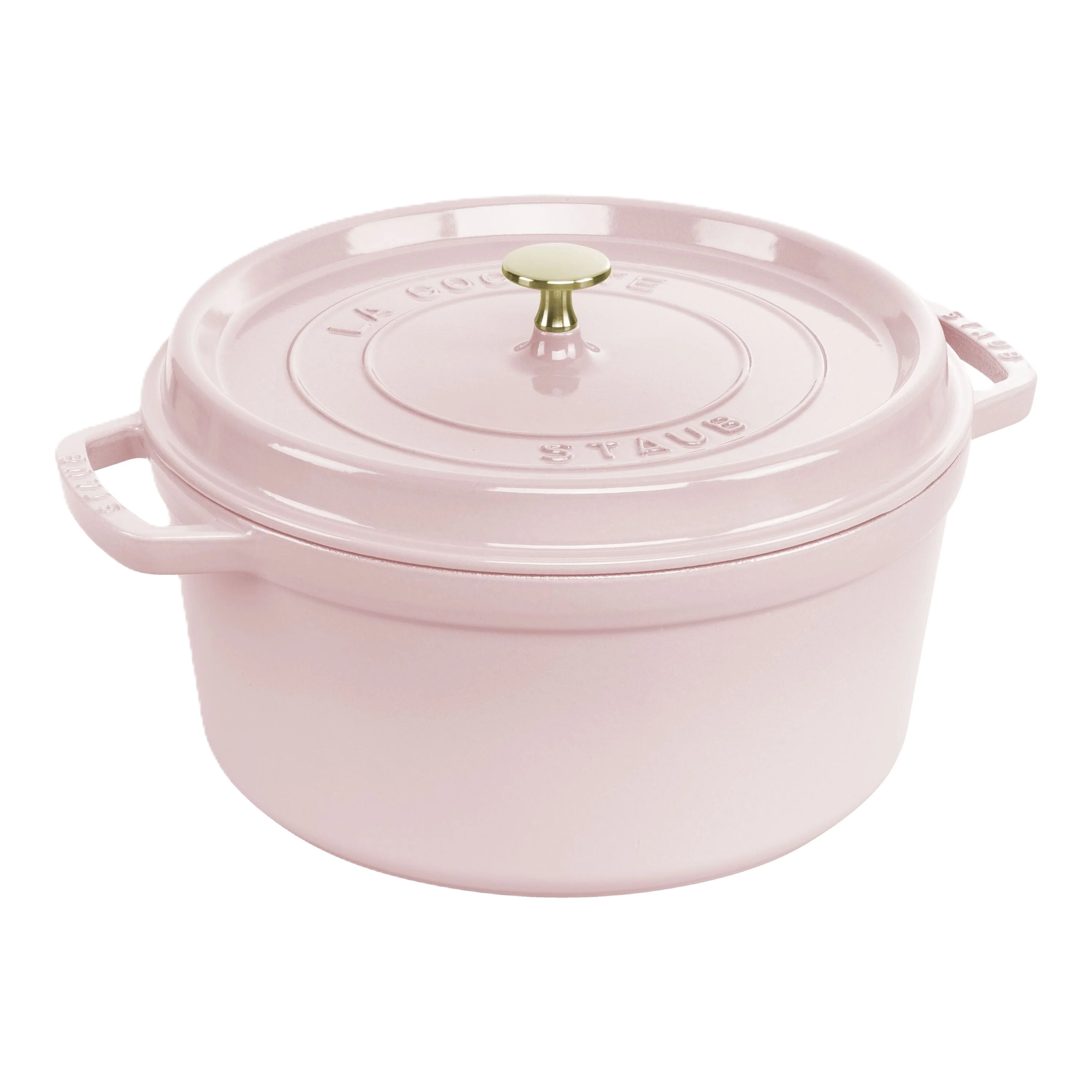 Pink Staub cocotte with a gold knob on a white background