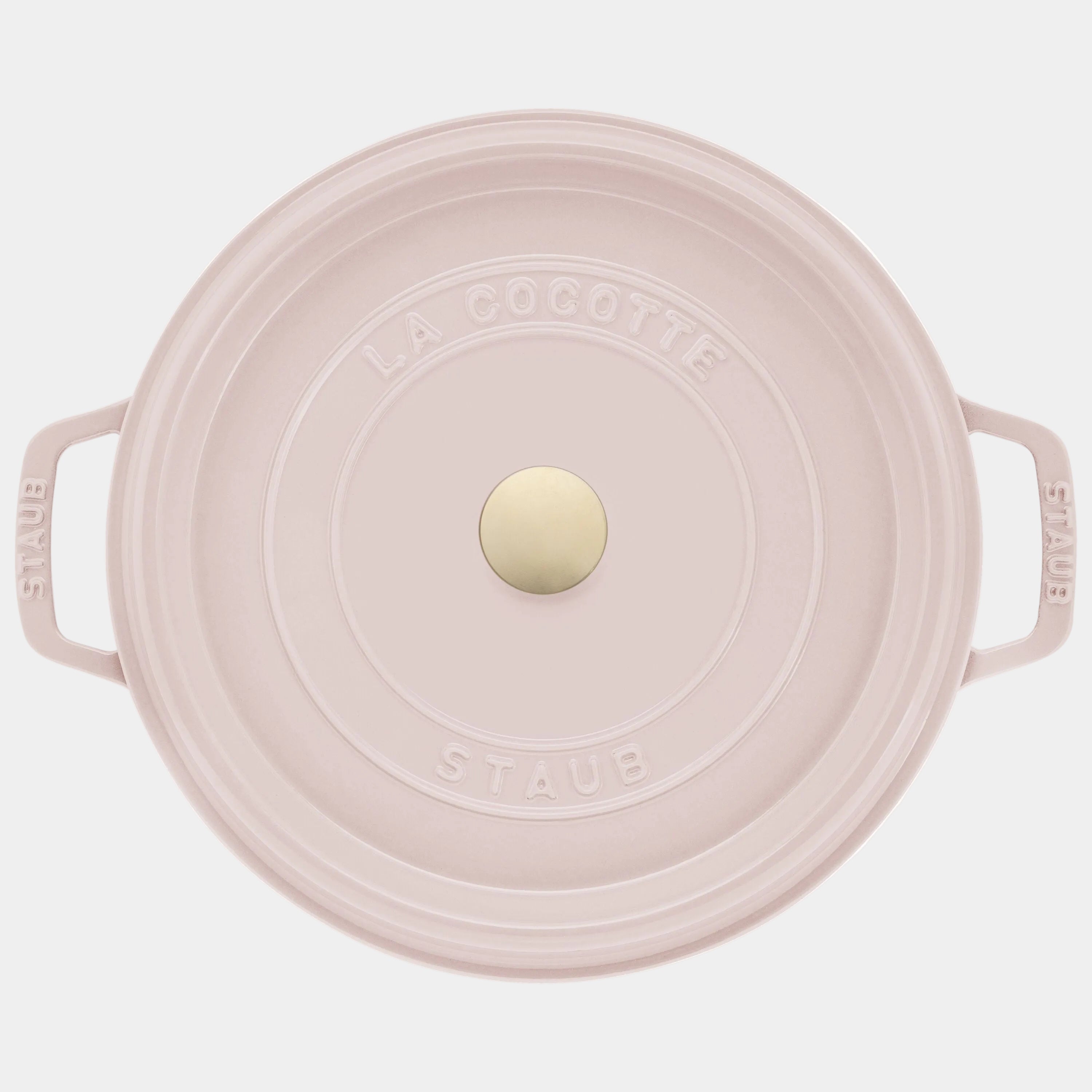 Pink Staub cocotte with a white background