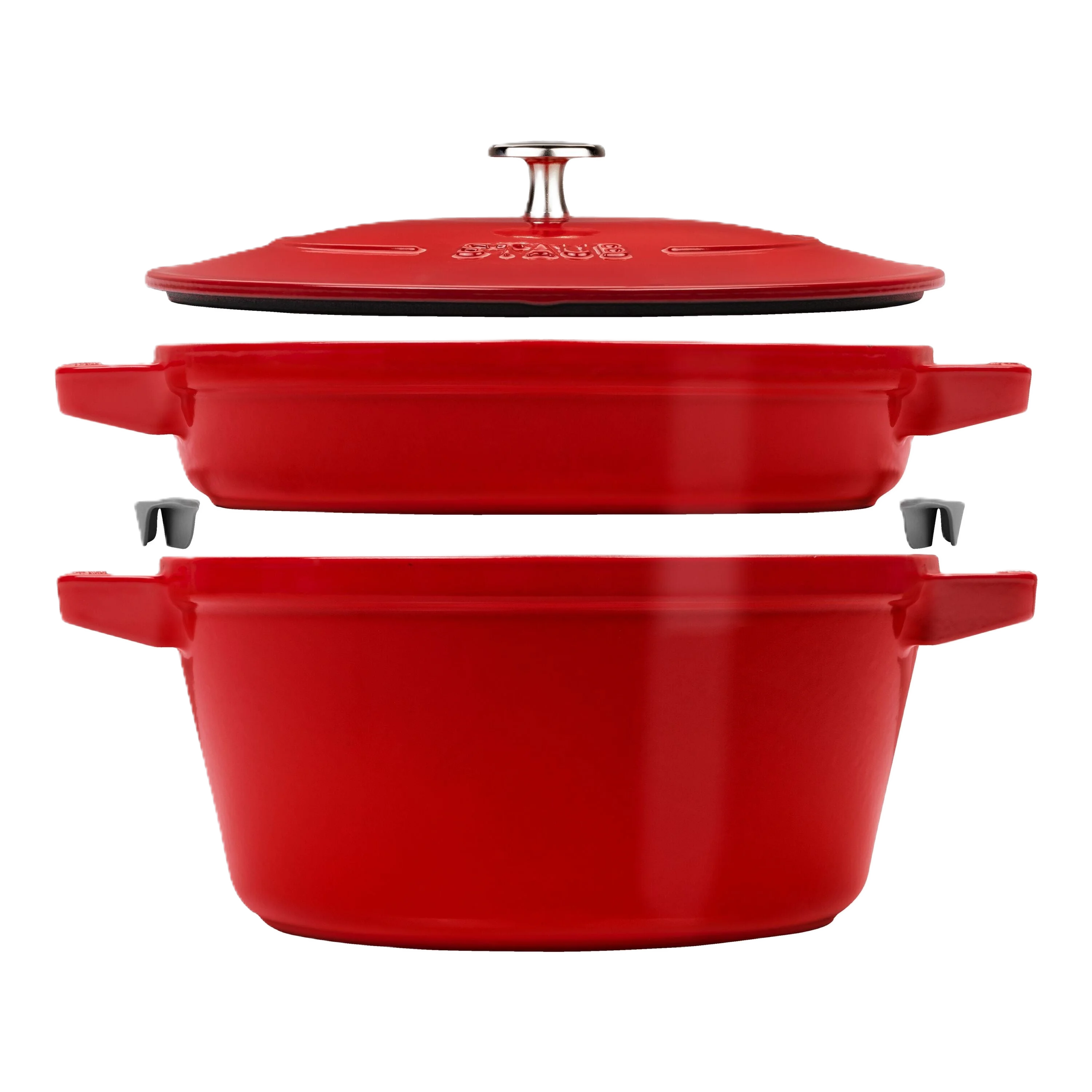 Red enameled cast iron cookware set with lid on a white background