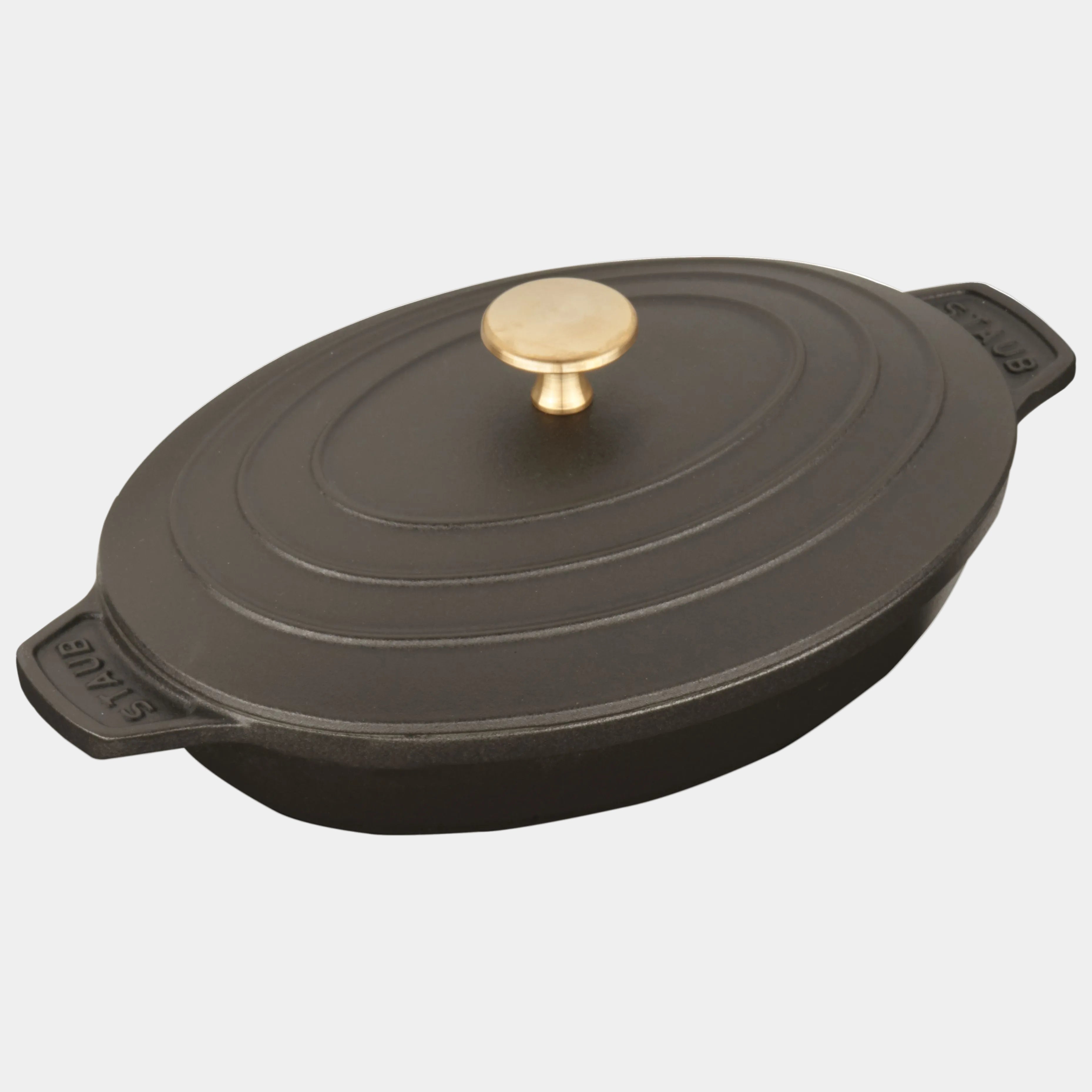 Black cast iron cookware with a gold knob on a white background