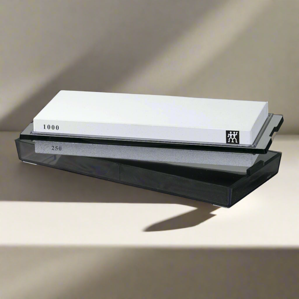ZWILLING Sharpening Stone, Pure-White shown on a display with a black holder.