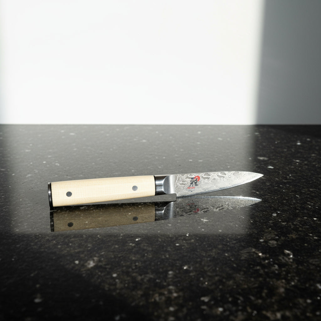 Decorative knife with a beige handle on a white background