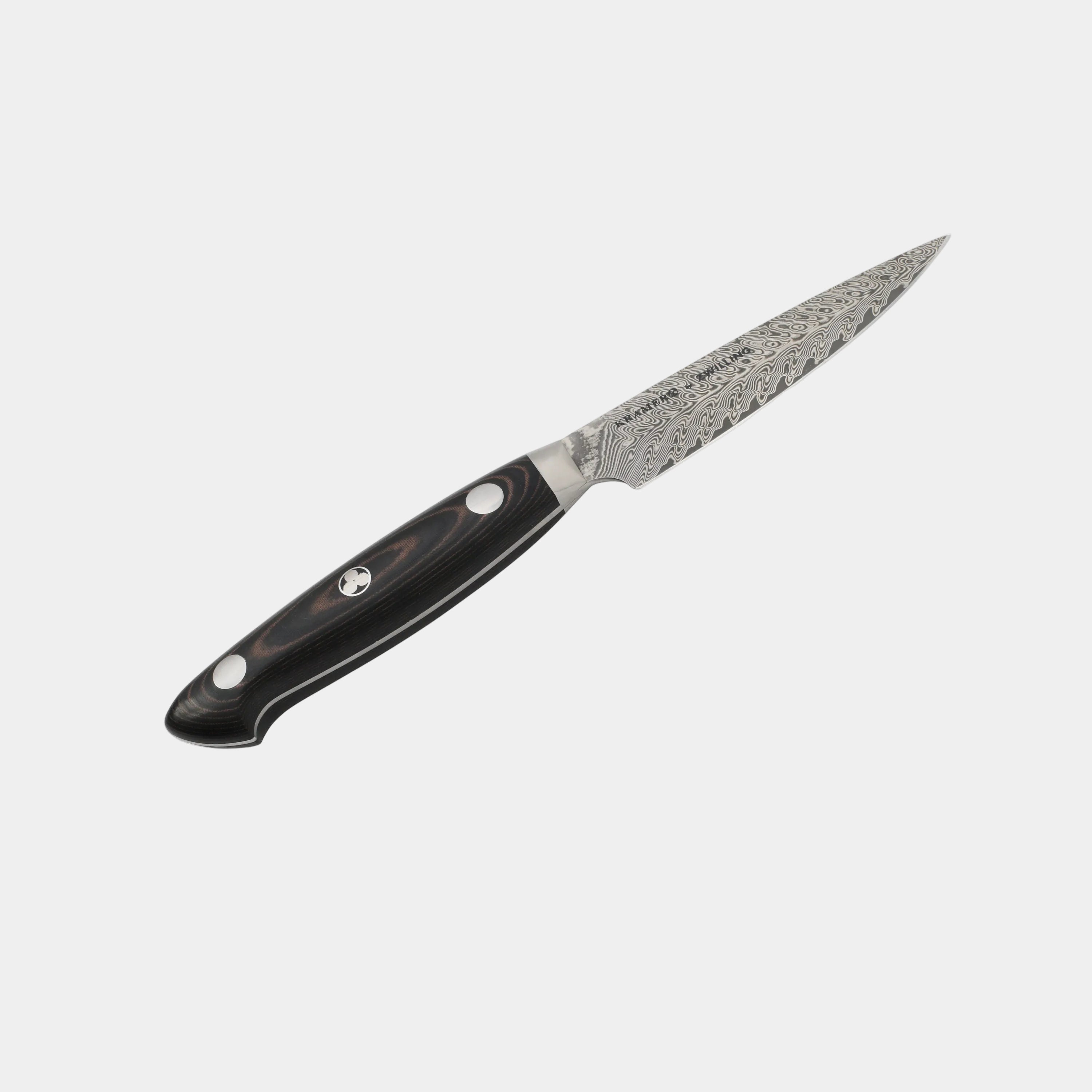 Forked knife with a black handle on a white background