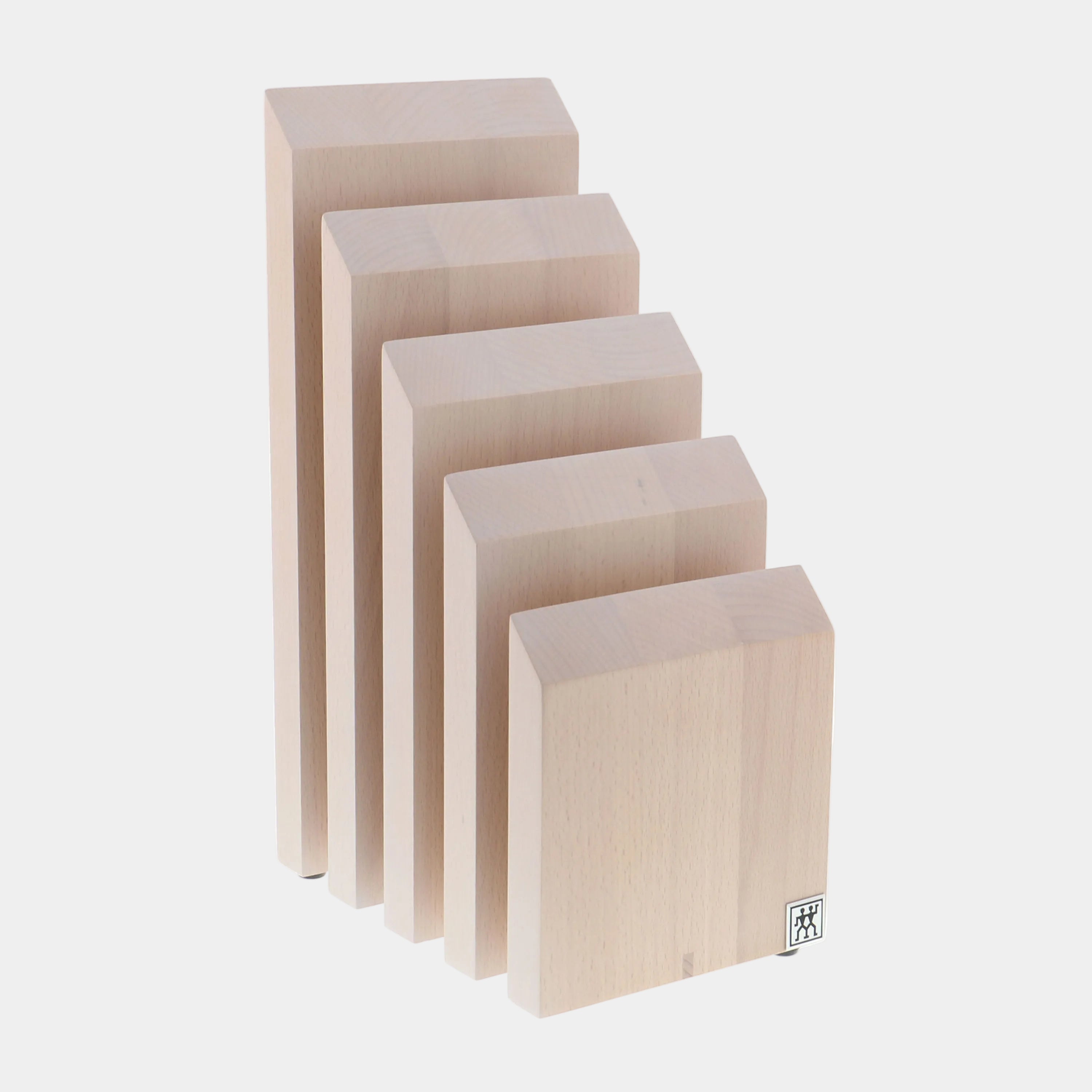Set of five wooden blocks of different sizes on a white background