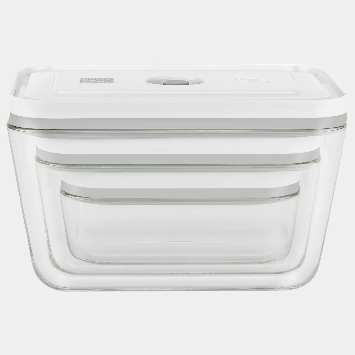 Clear glass food storage container with white lid on a white background
