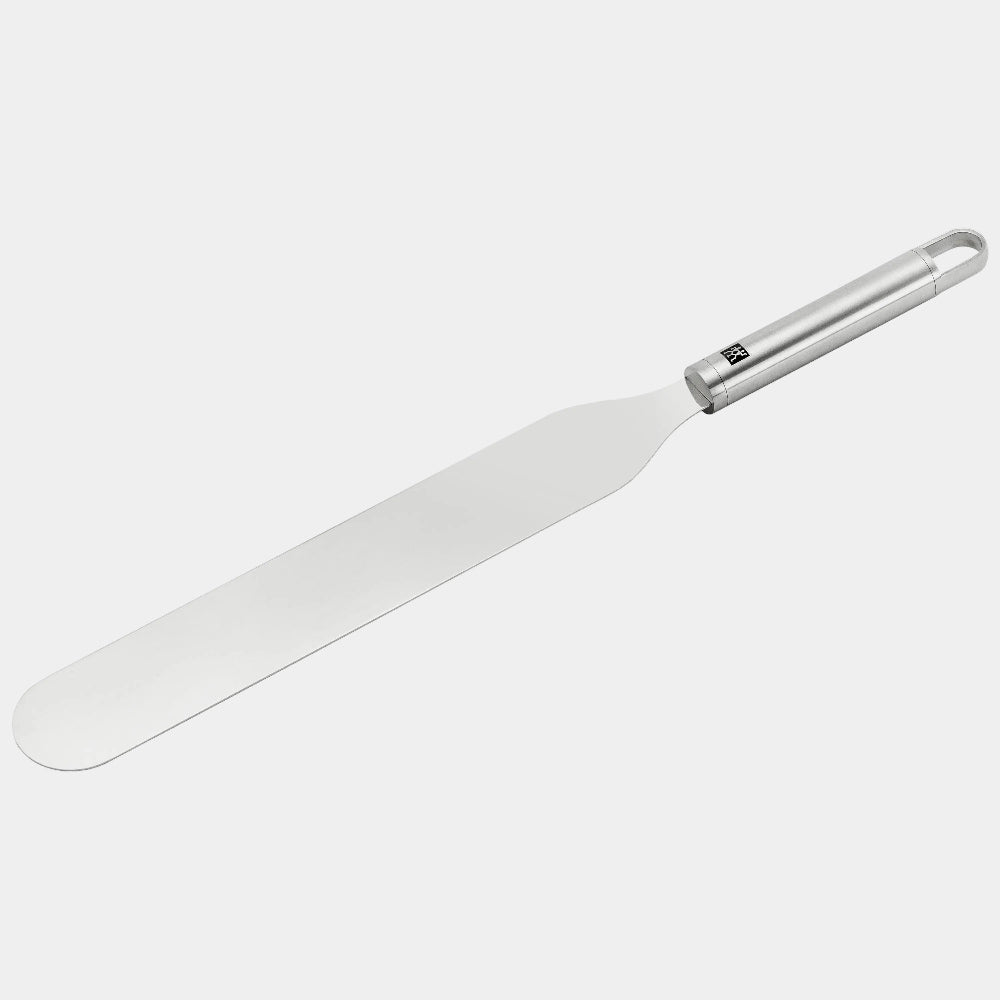 White spatula with a silver handle on a white background
